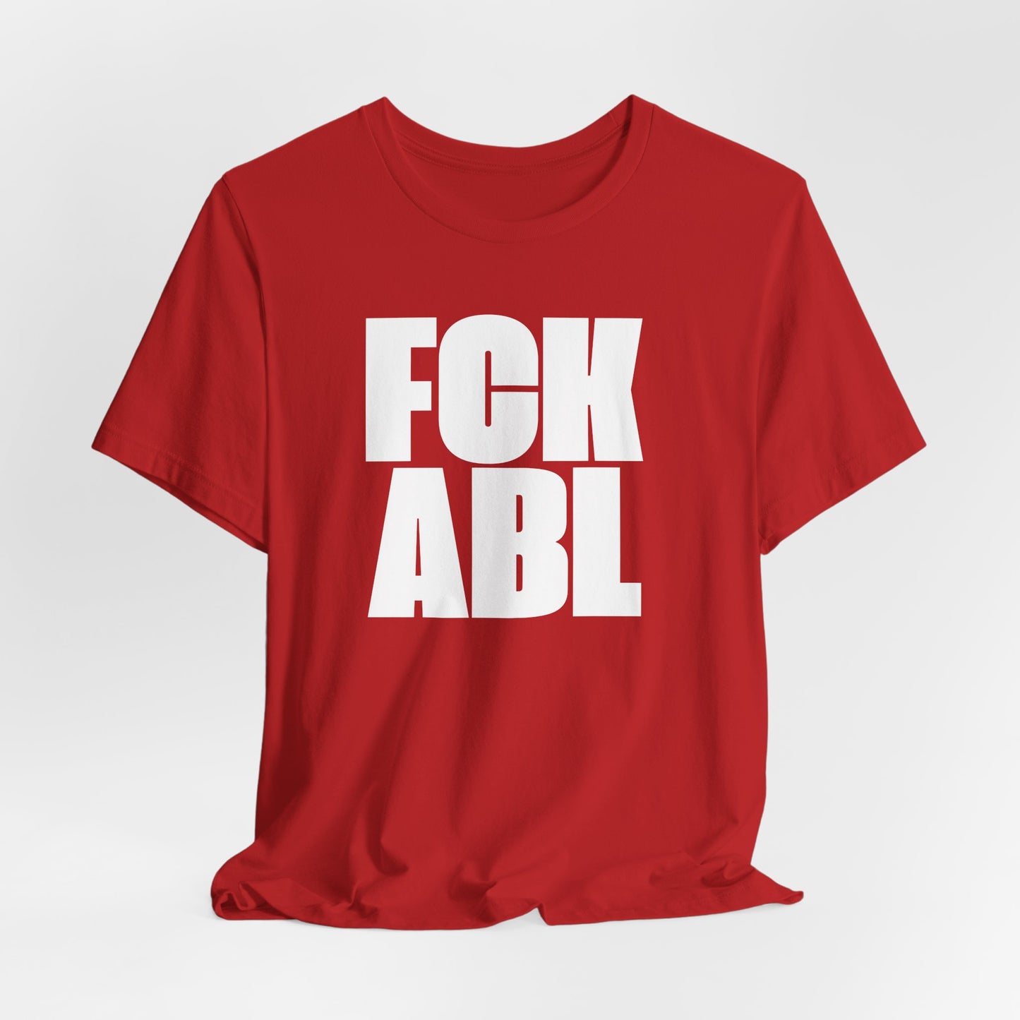 Red t-shirt with white text 'FCK ABL' on a light gray background