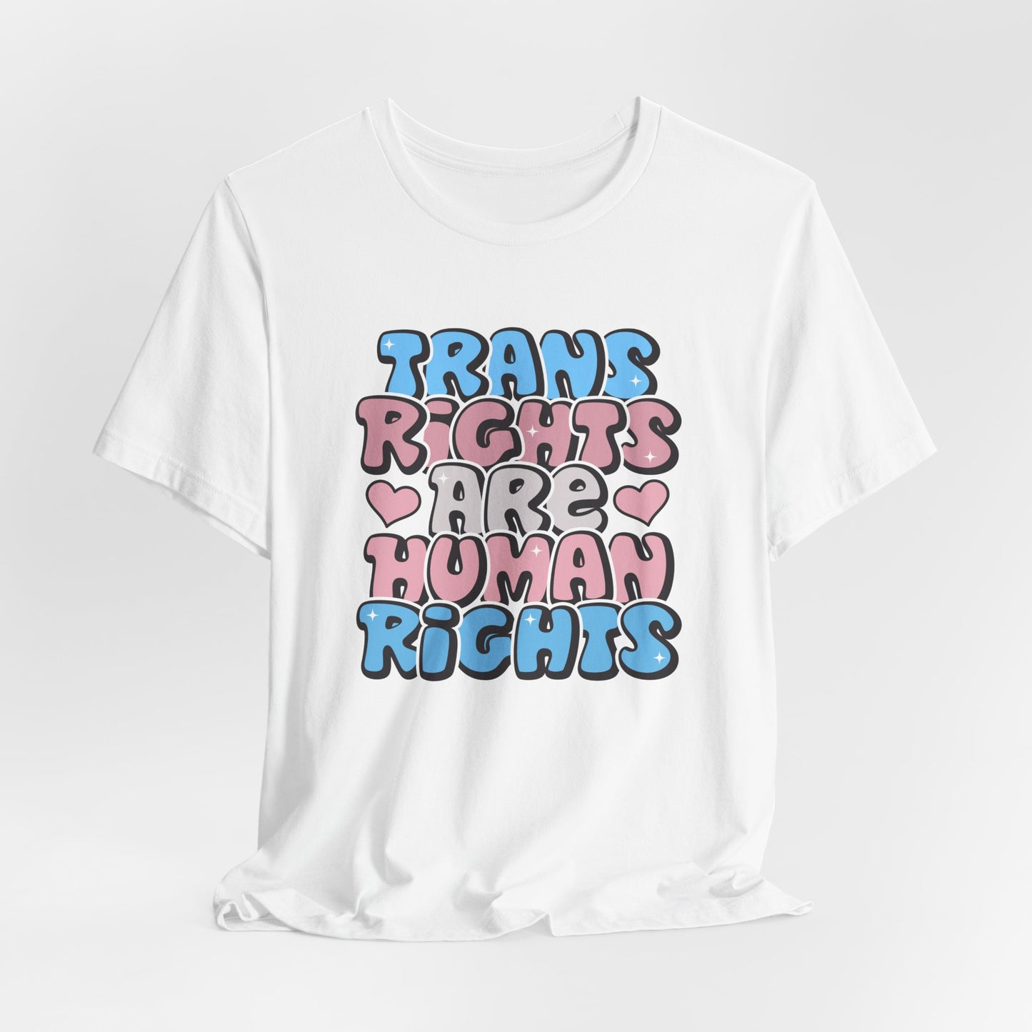 White t-shirt with 'Trans Rights Are Human Rights' text in colorful letters on a white background LGBTQIA+, Queer, Trans rights