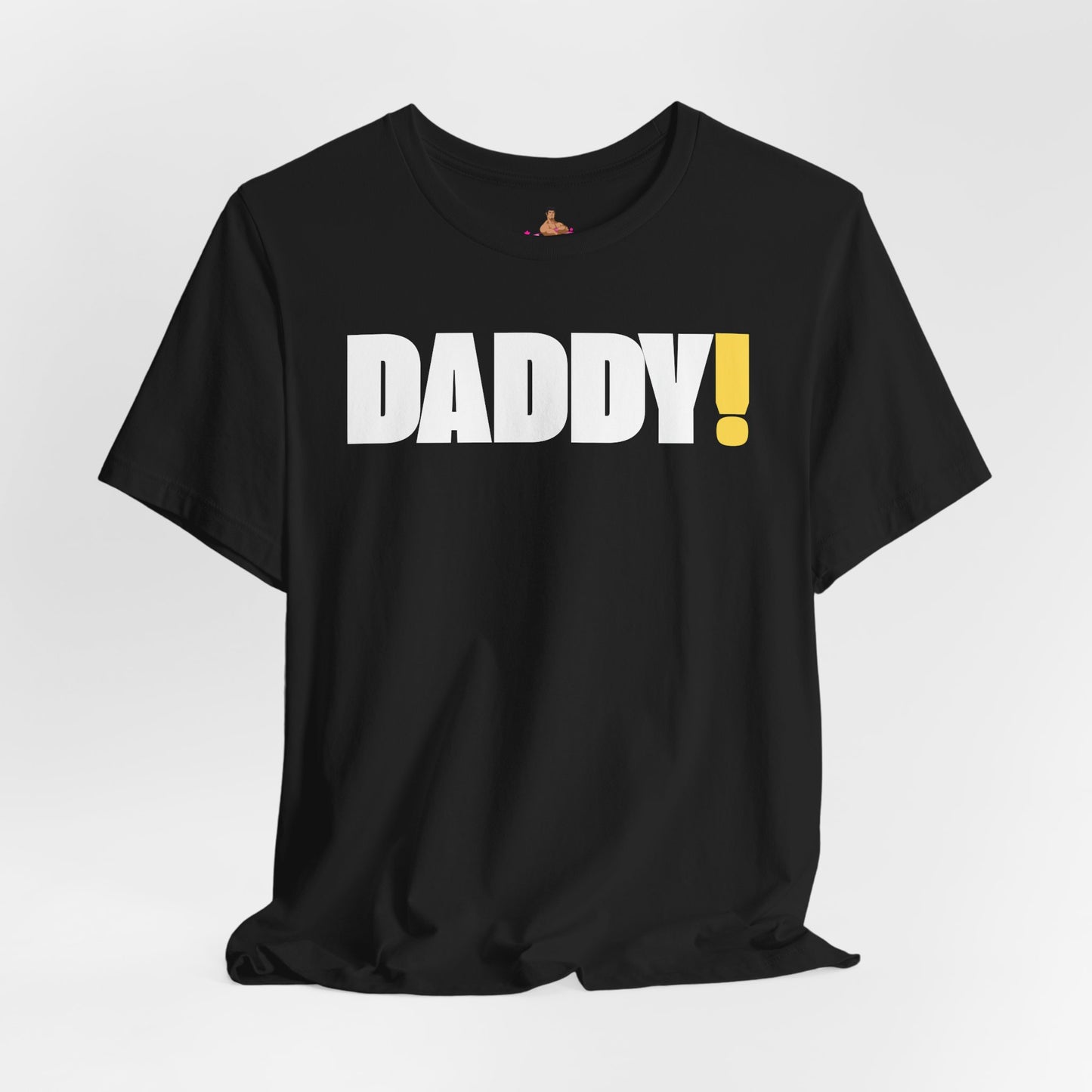 Man wearing a black t-shirt with 'DADDY!' text against a dark background LGBTQIA+ Kink Positive