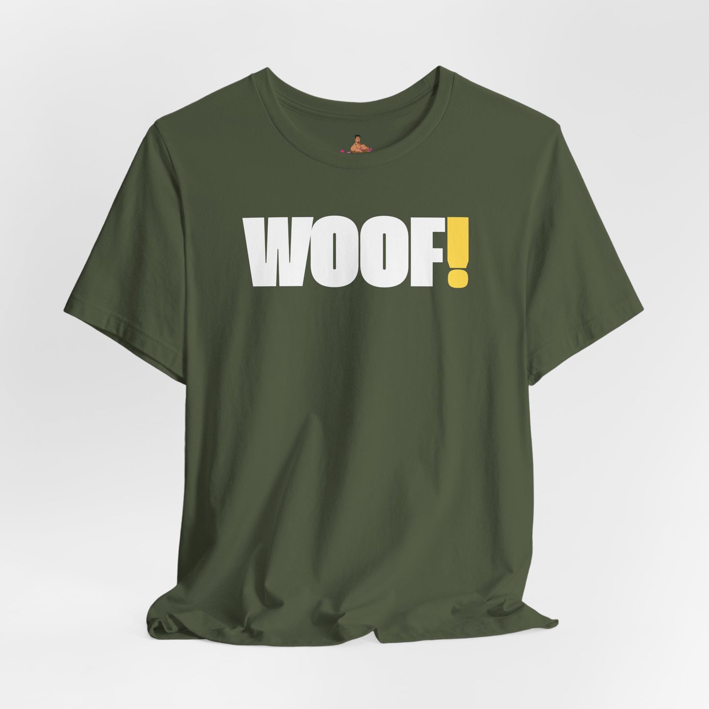 Man wearing a black t-shirt with 'WOOF!' text against a dark background LGBTQIA+ QUEER, Kink Positive