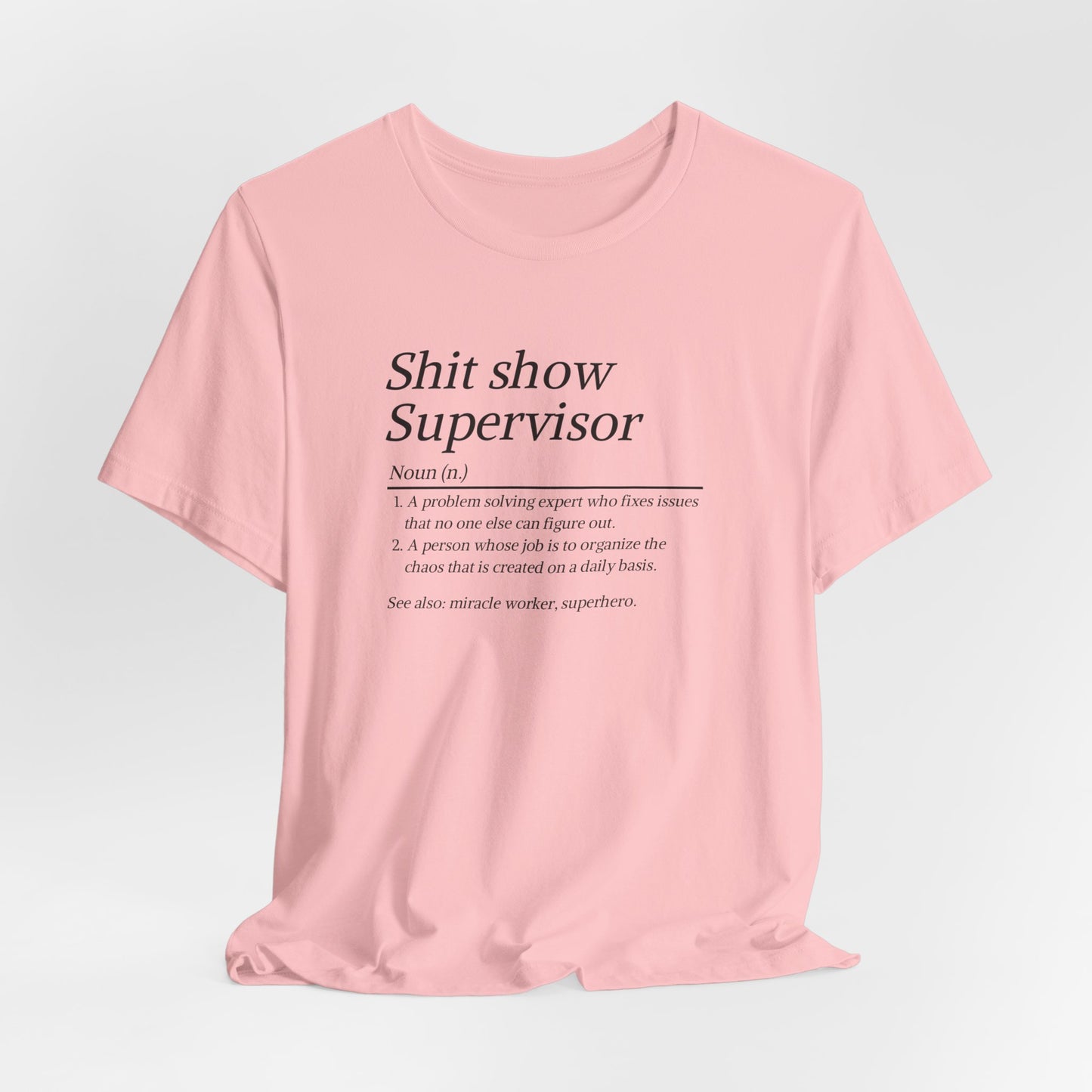 Pink t-shirt with text on a light gray background