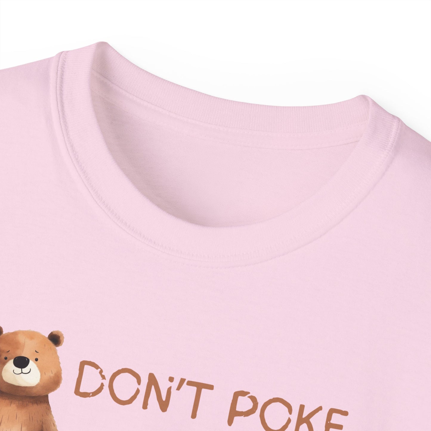 Pink shirt with a bear graphic and 'DON'T POKE' text on a white background