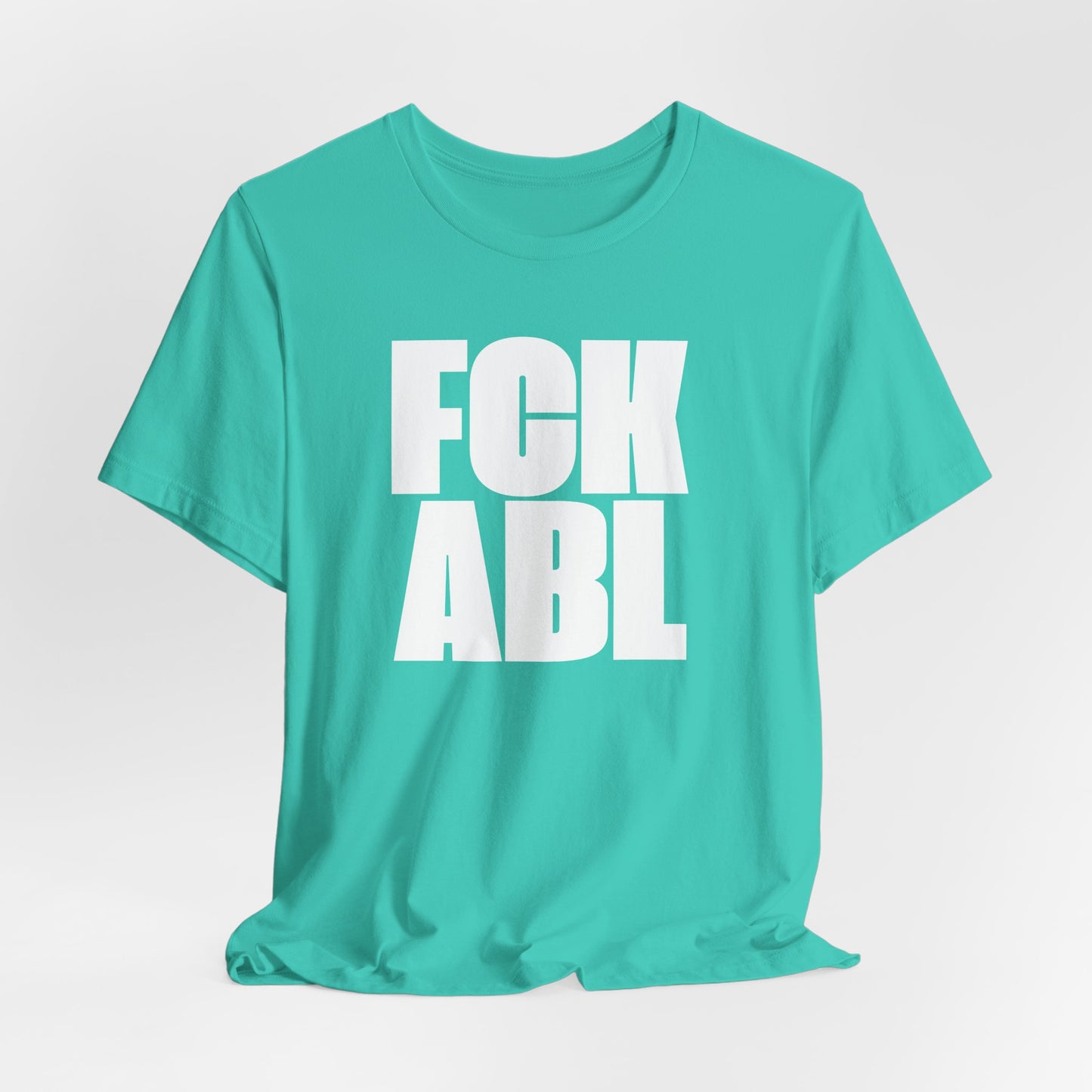 Turquoise t-shirt with white text on a light gray background