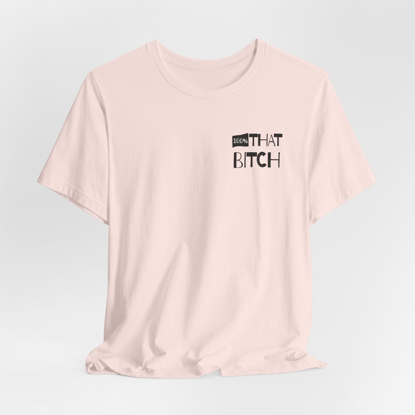 Pink t-shirt with text on a light gray background 100% that Bitch