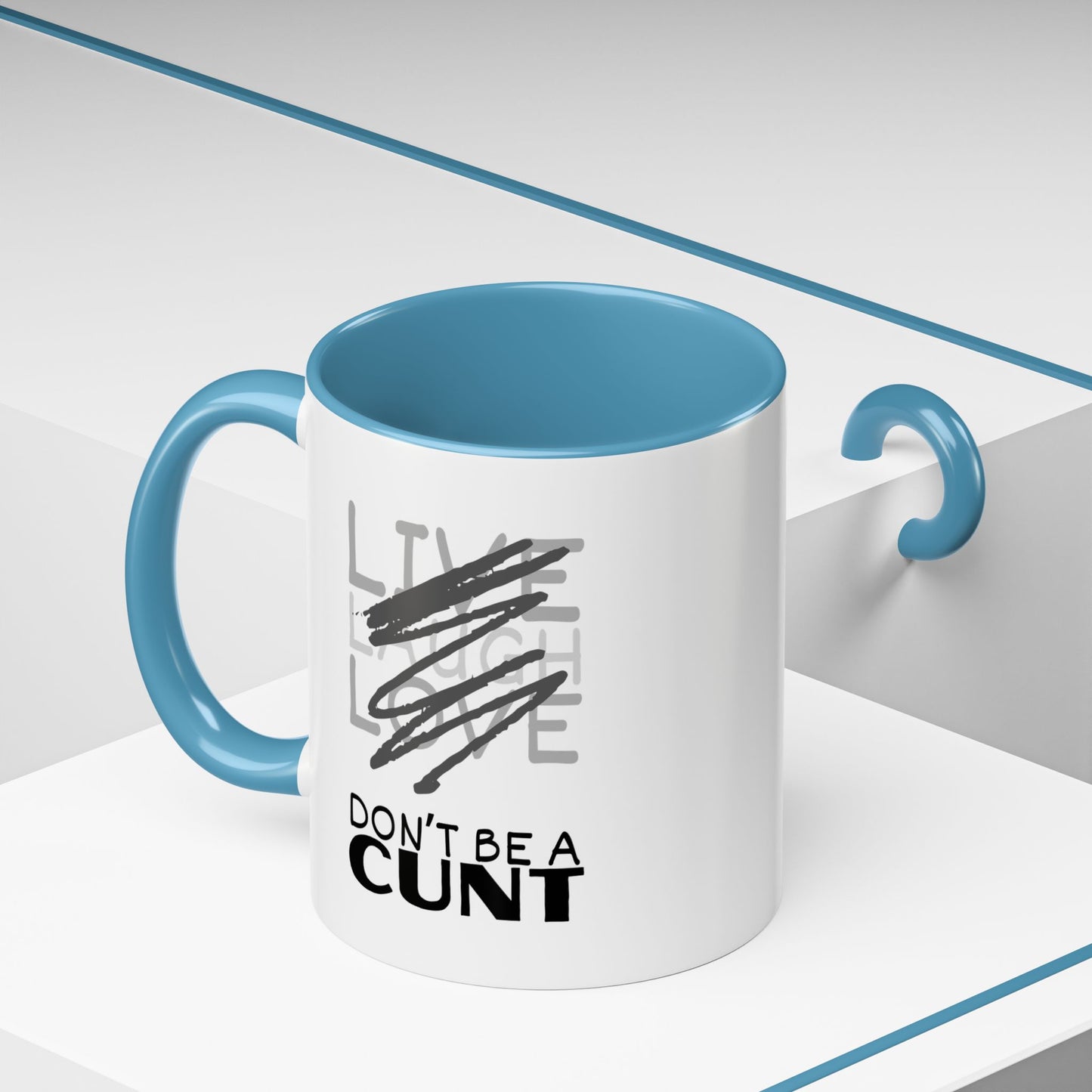 White mug with blue interior and handle, featuring a printed message.