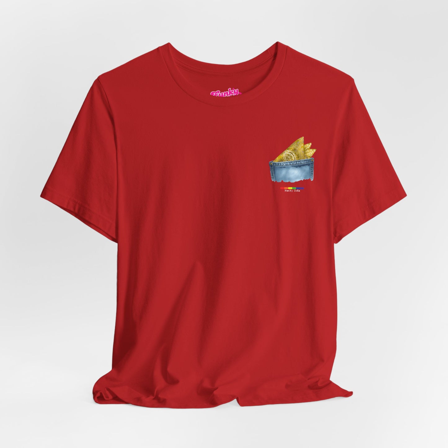 Red t-shirt with a small graphic of a pocket with a paisley print hanky tucked inside. it features the LGBT rainbow colours and the words Hanky Code
