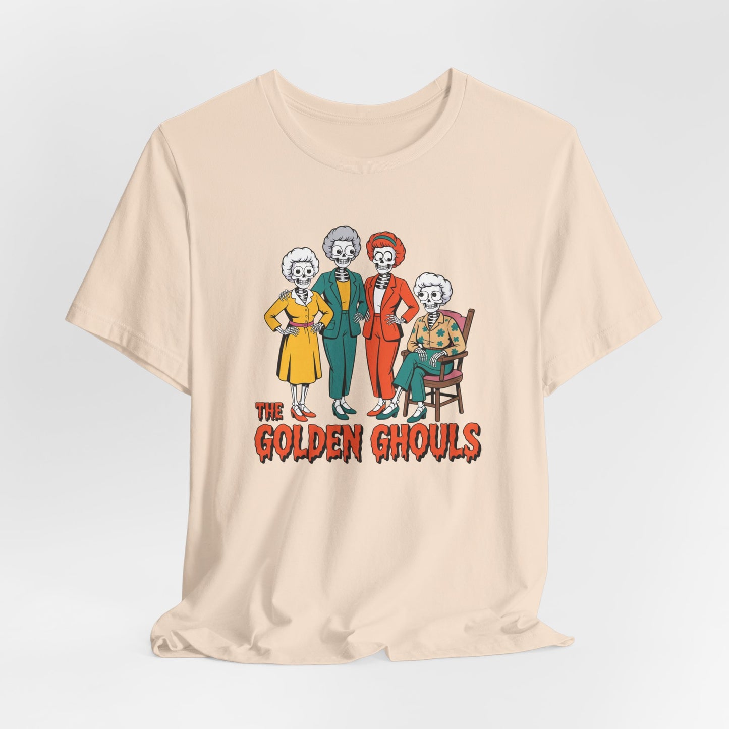 Beige t-shirt with 'The Golden Ghouls' graphic design on a light gray background   Golden Girls, 80s TV, Halloween Tees