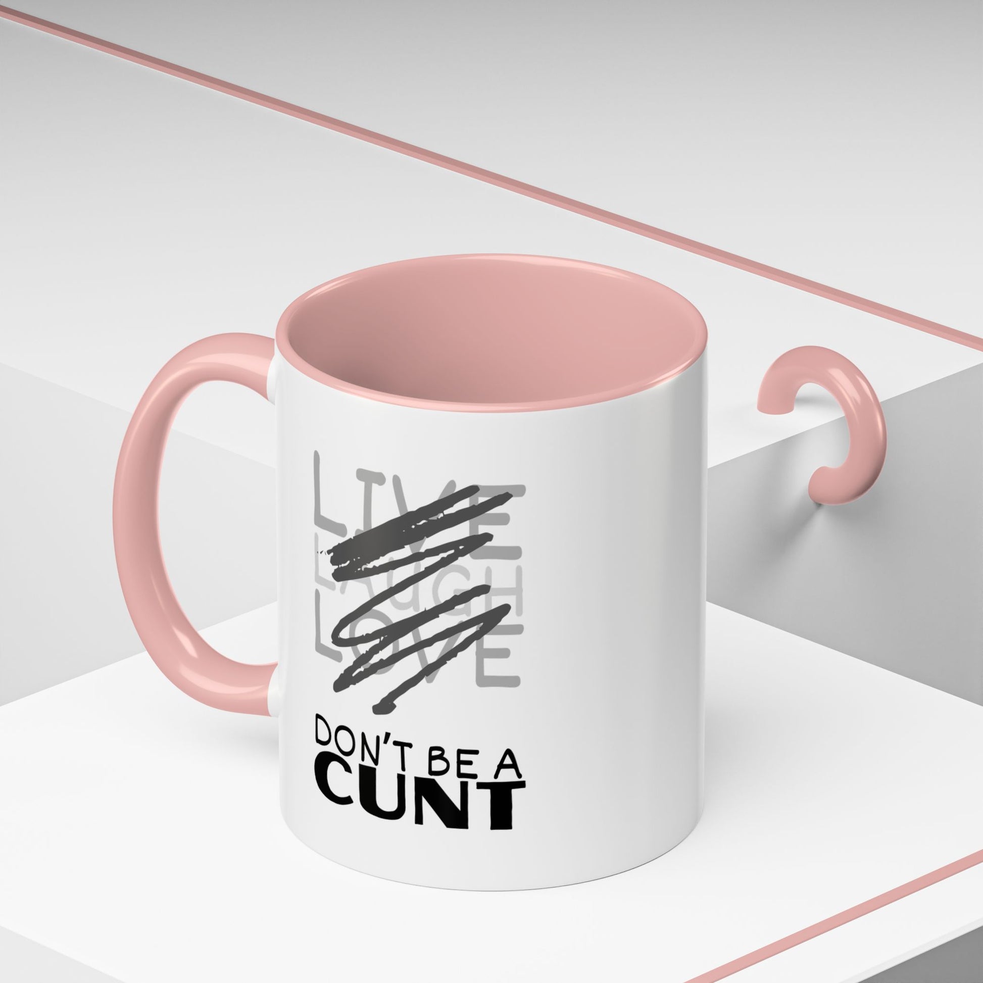 White mug with pink interior and handle, featuring a graphic and text on a white background.