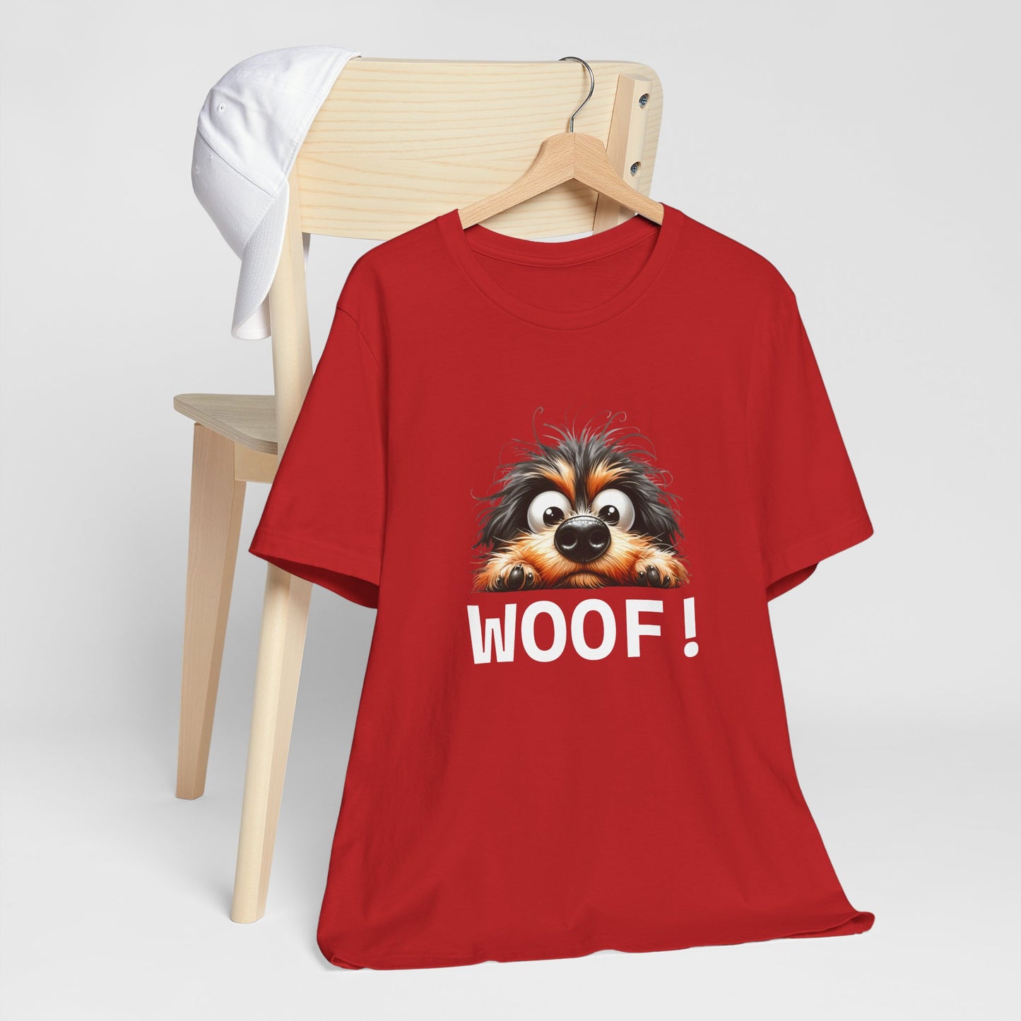 Red t-shirt with a dog graphic and 'WOOF!' text on a white background