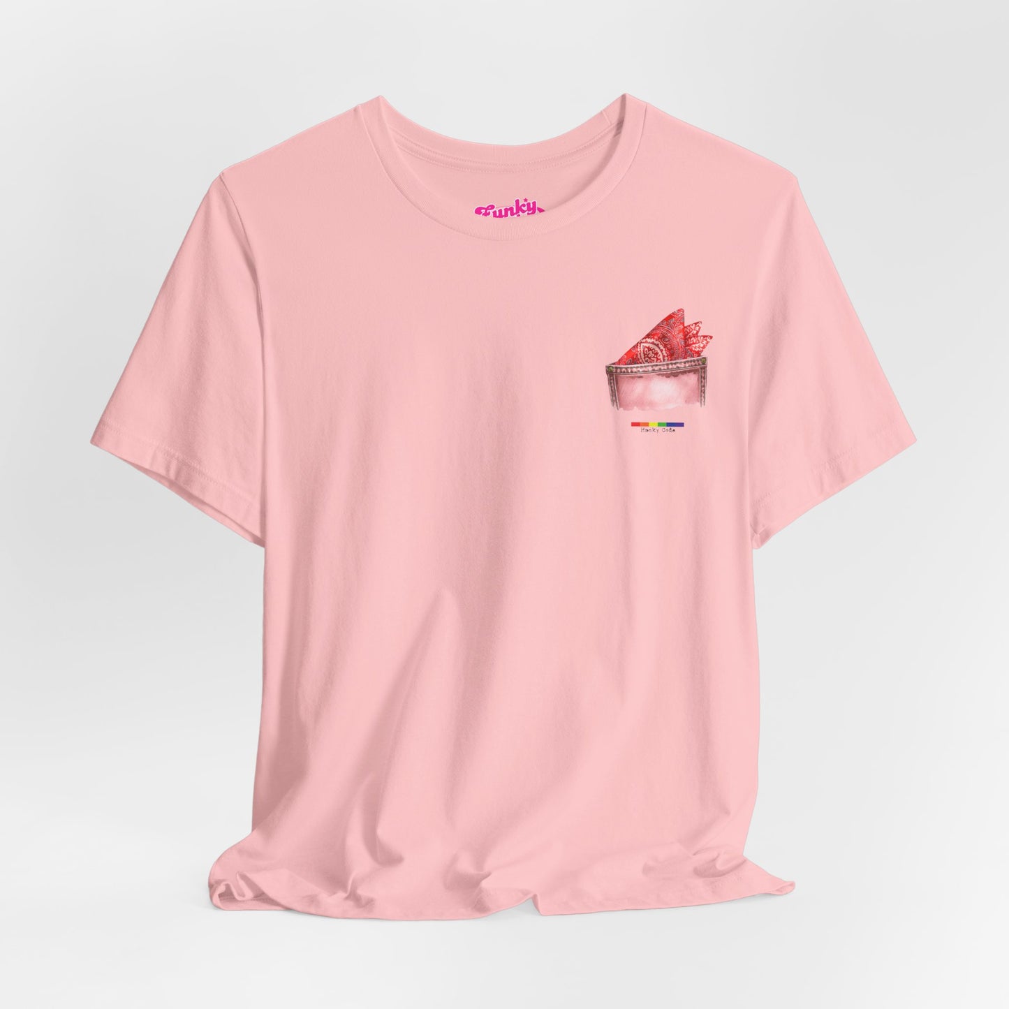 Pink t-shirt with a small graphic of a pocket with a paisley print hanky tucked inside. it features the LGBT rainbow colours and the words Hanky Code