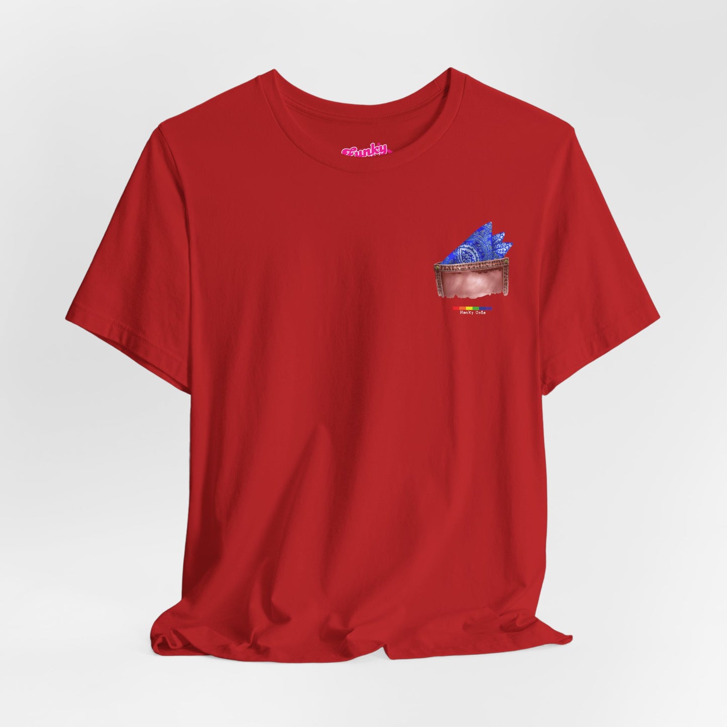Red t-shirt with a small graphic of a pocket with a paisley print hanky tucked inside. it features the LGBT rainbow colours and the words Hanky Code