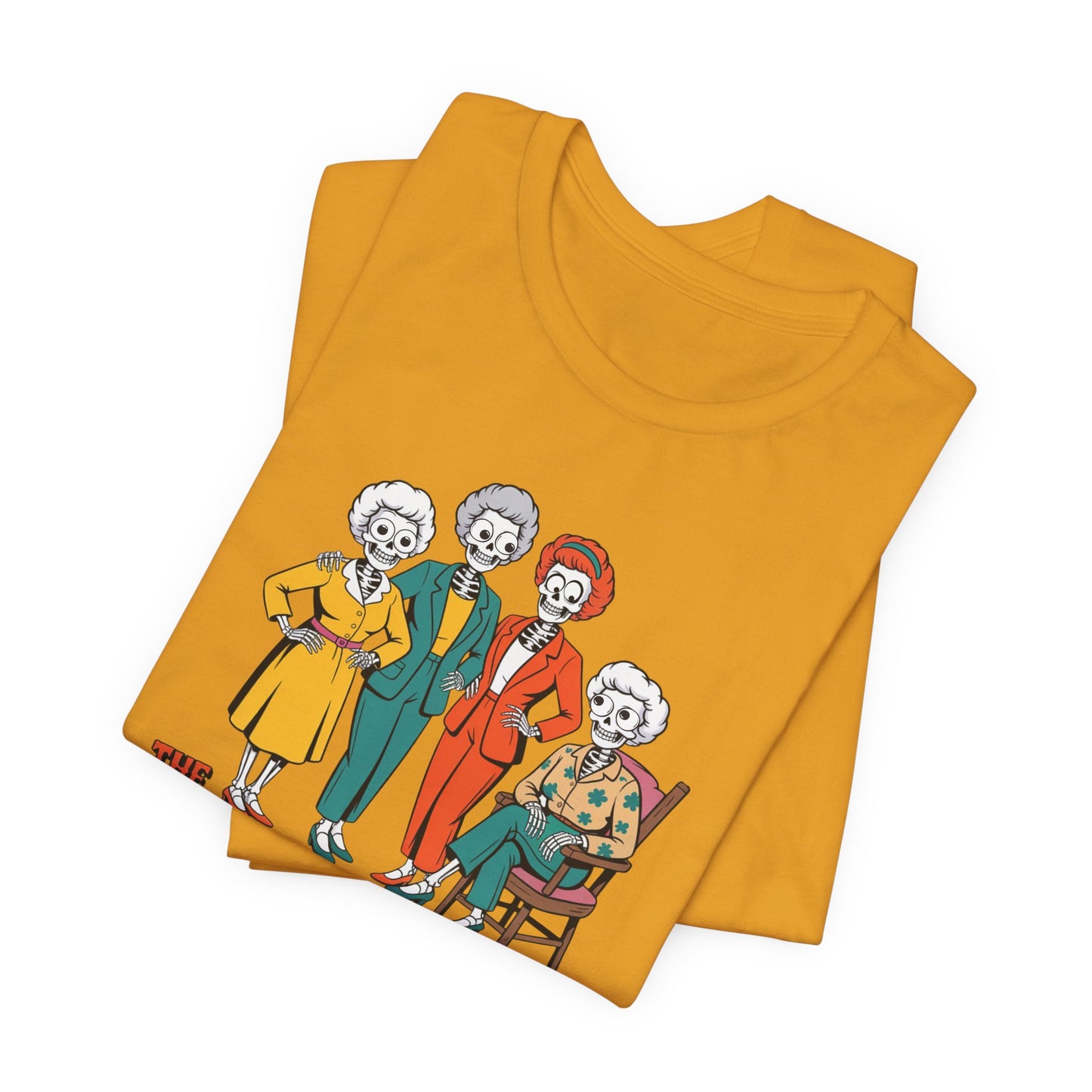Folded mustard yellow t-shirt with cartoon characters on a white background   Golden Girls, 80s TV, Halloween Tees