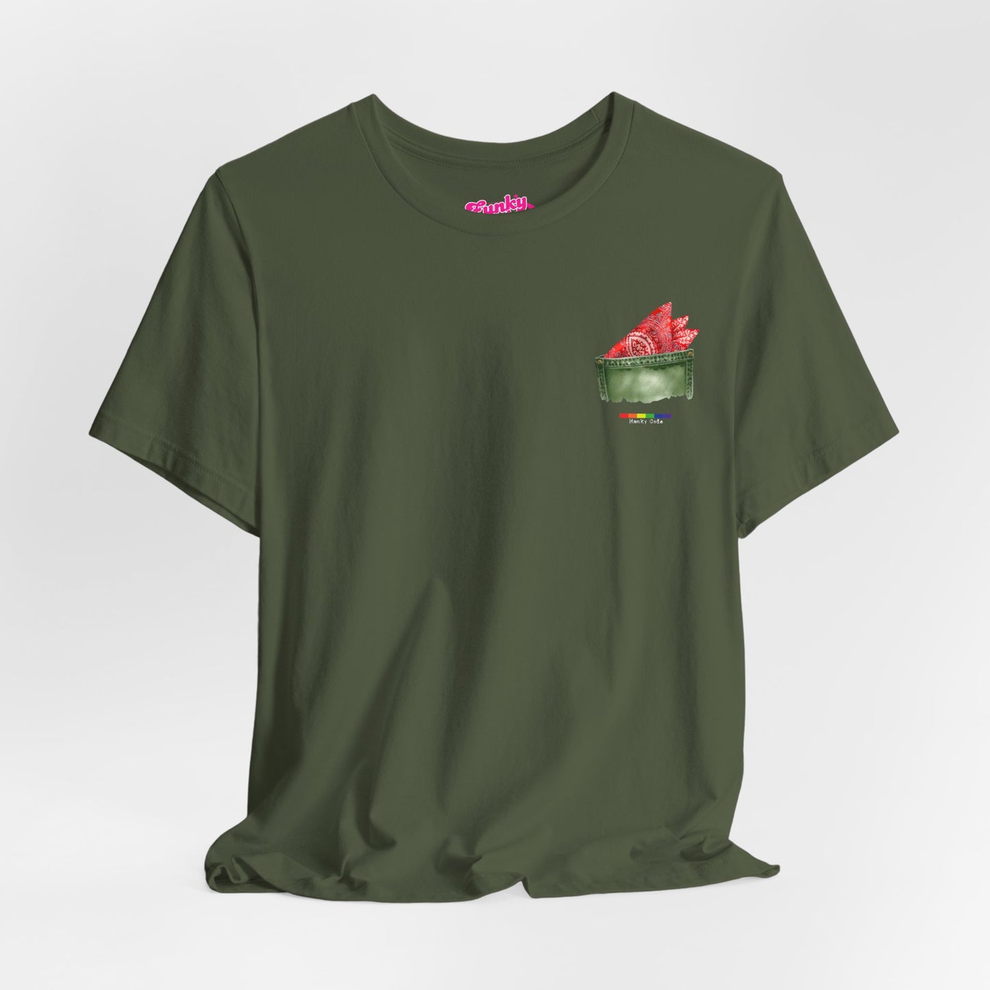 Green t-shirt with a small graphic of a pocket with a paisley print hanky tucked inside. it features the LGBT rainbow colours and the words Hanky Code
