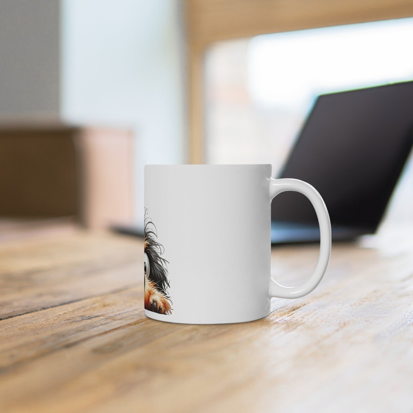 White mug with a printed design on a wooden desk