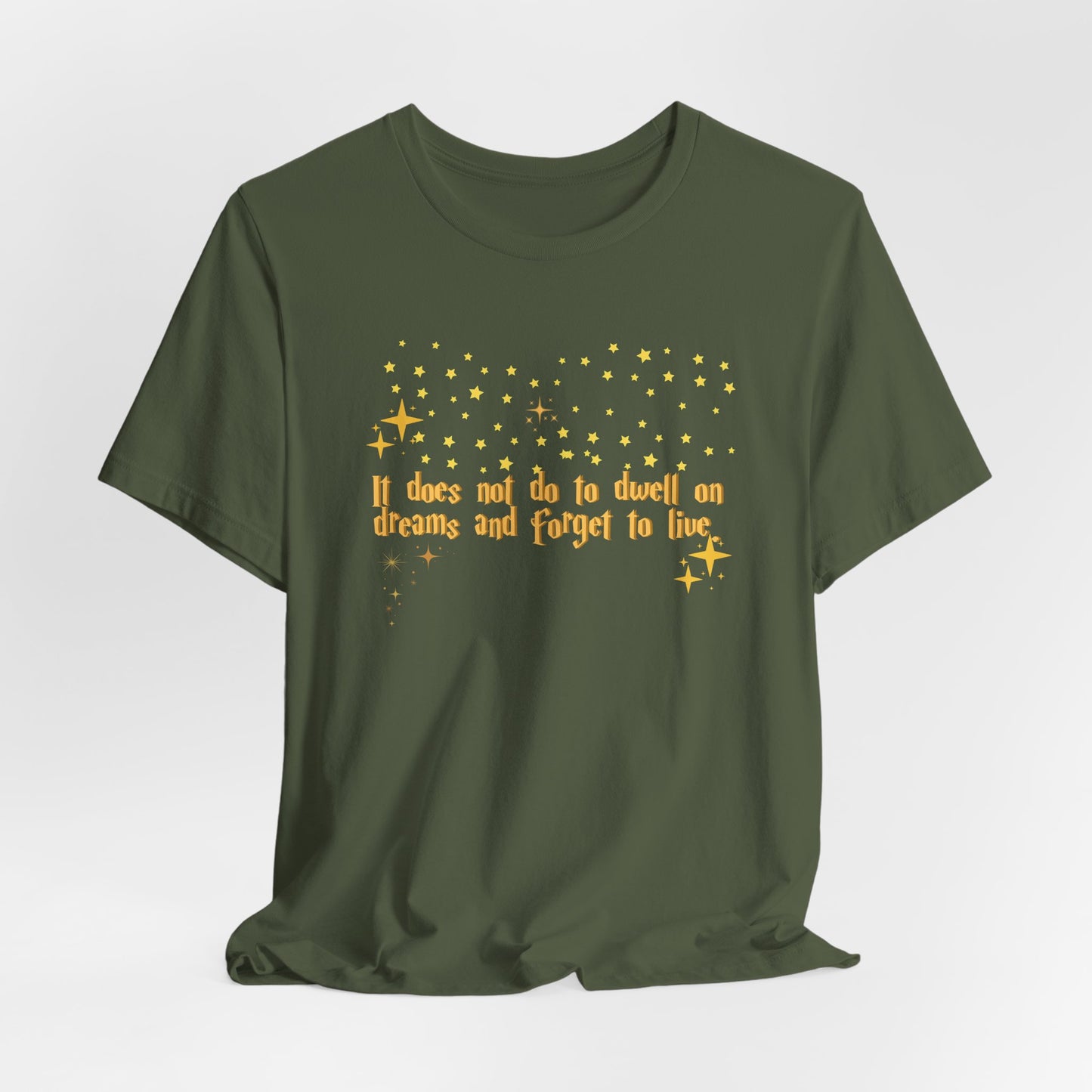 Green t-shirt with yellow text and star graphics on a white background, Dumbledore inspired quote, harry potter.