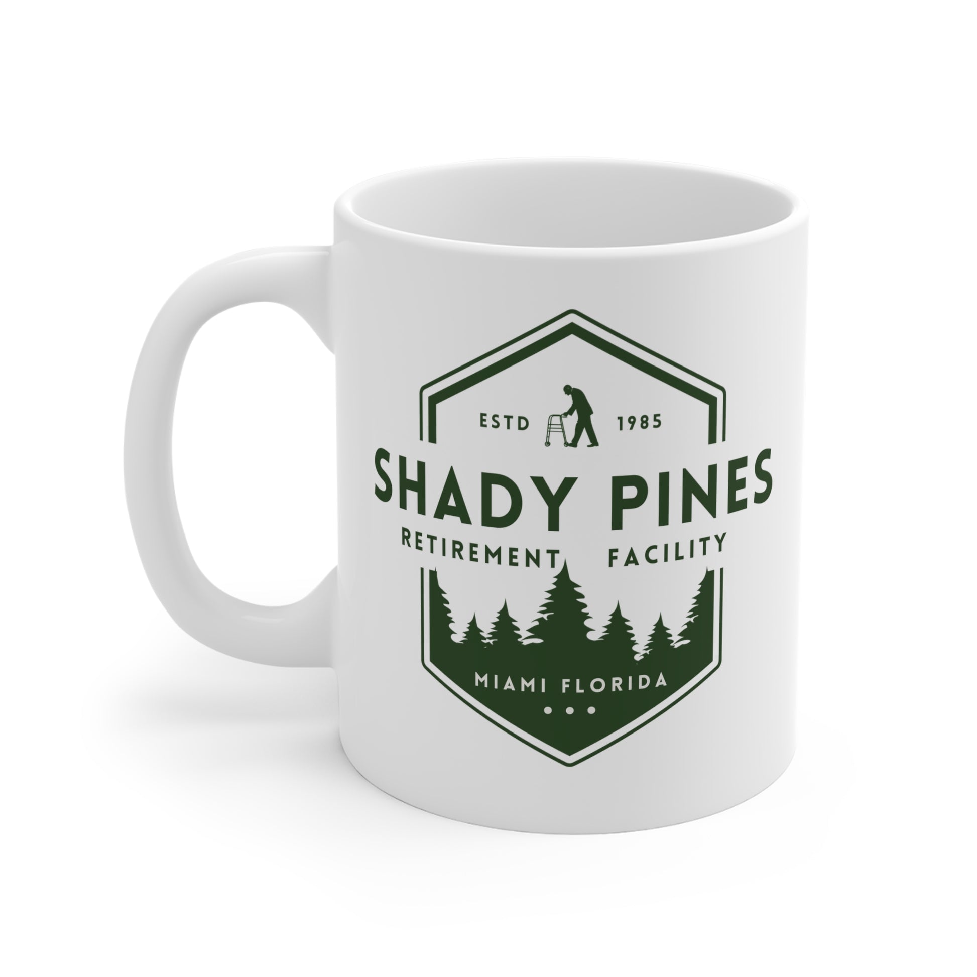 White mug with 'Shady Pines Retirement Facility' design on a white background