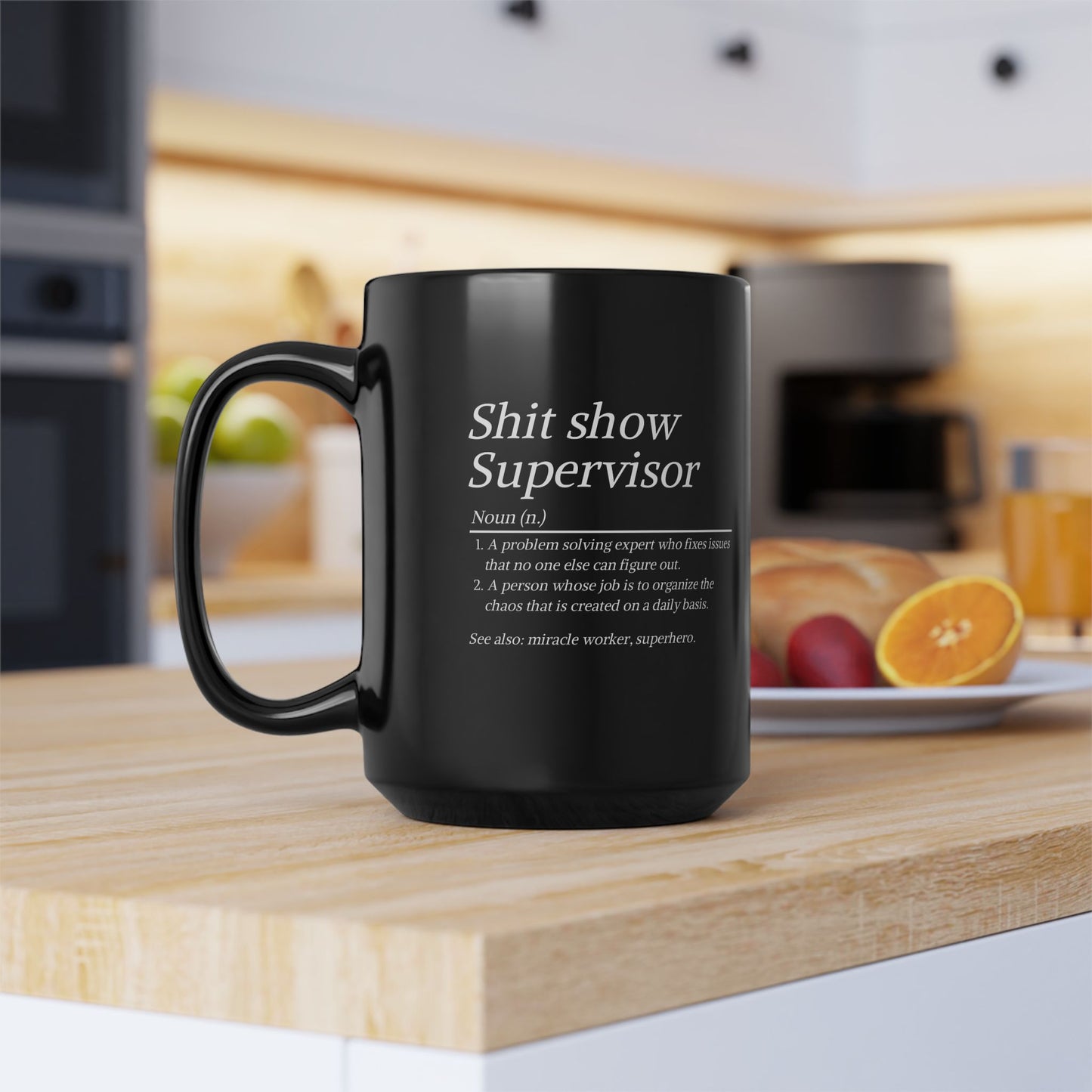Black mug with text on a kitchen counter
