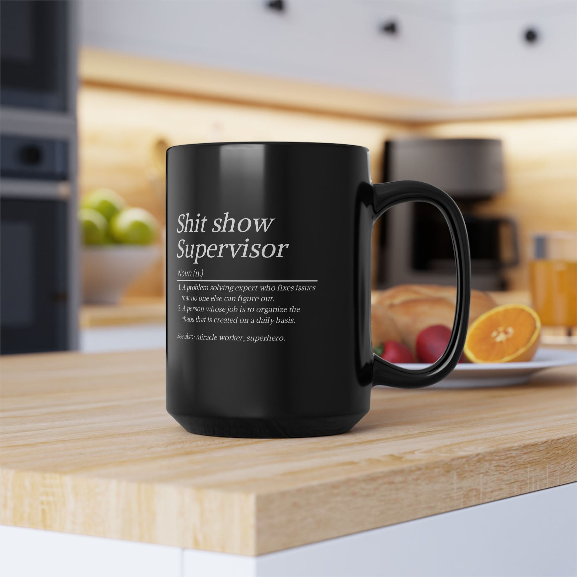Black mug with text on a kitchen counter