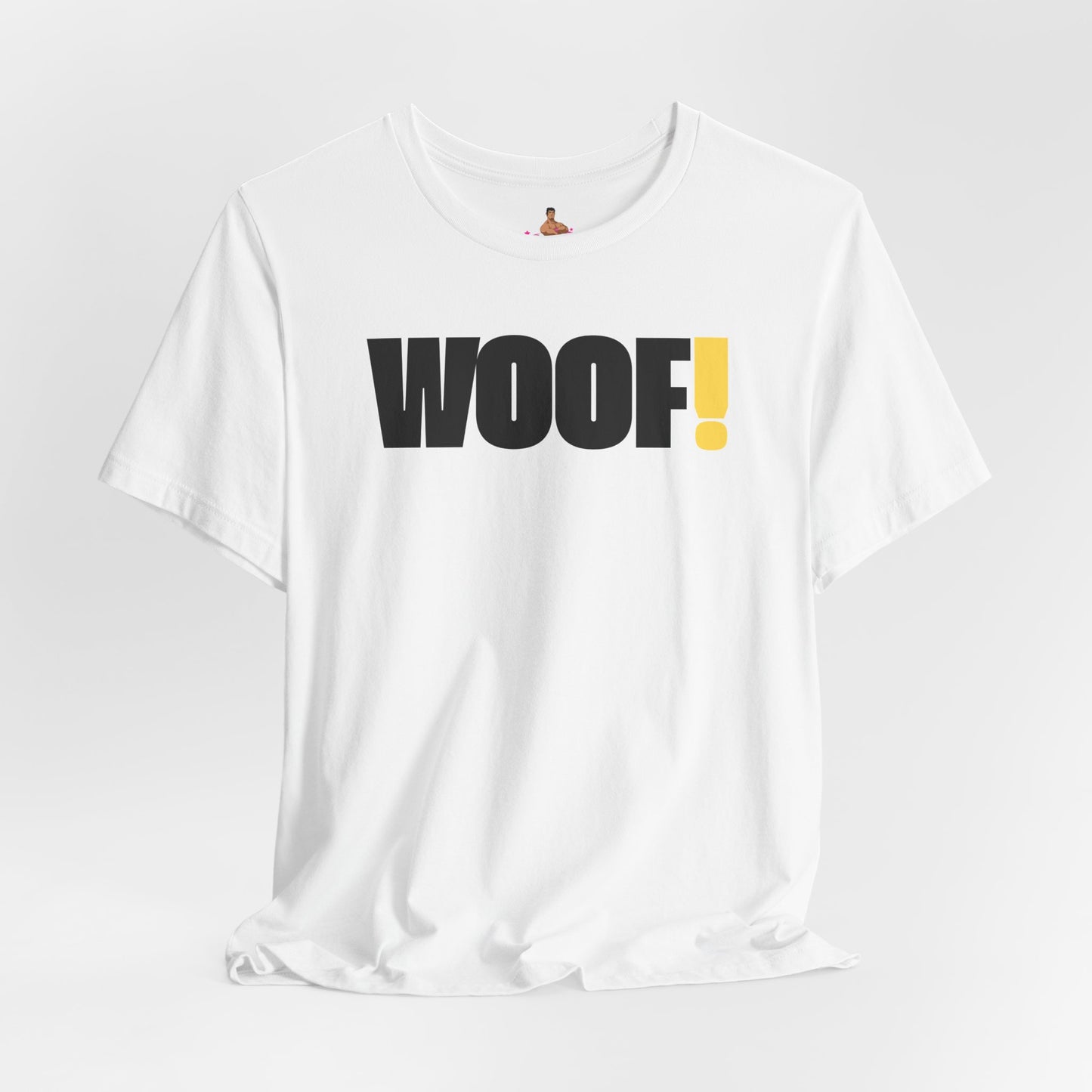 Man wearing a black t-shirt with 'WOOF!' text against a dark background LGBTQIA+ QUEER, Kink Positive