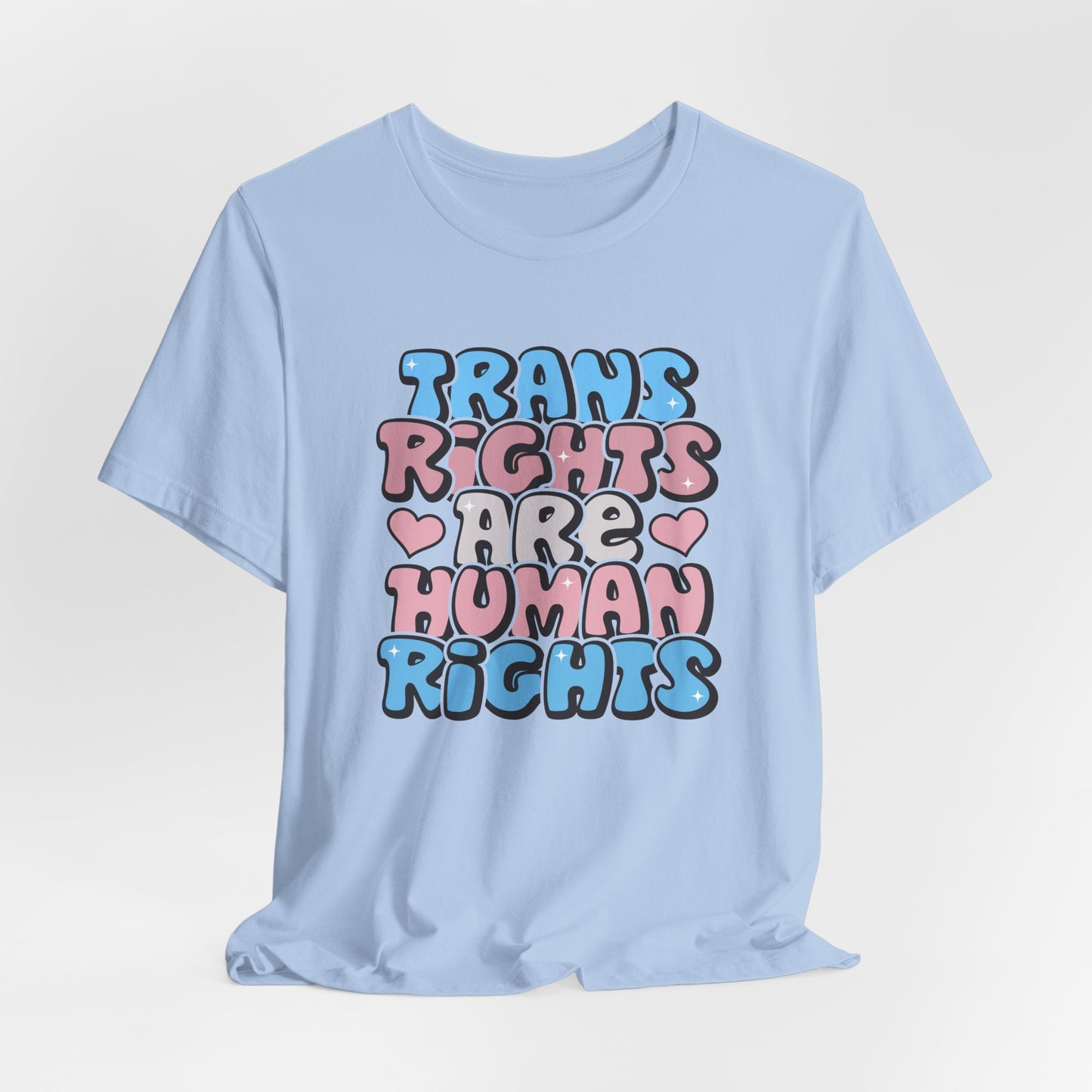 Light blue t-shirt with 'Trans Rights Are Human Rights' text on a light gray background  LGBTQIA+, Queer, Trans rights