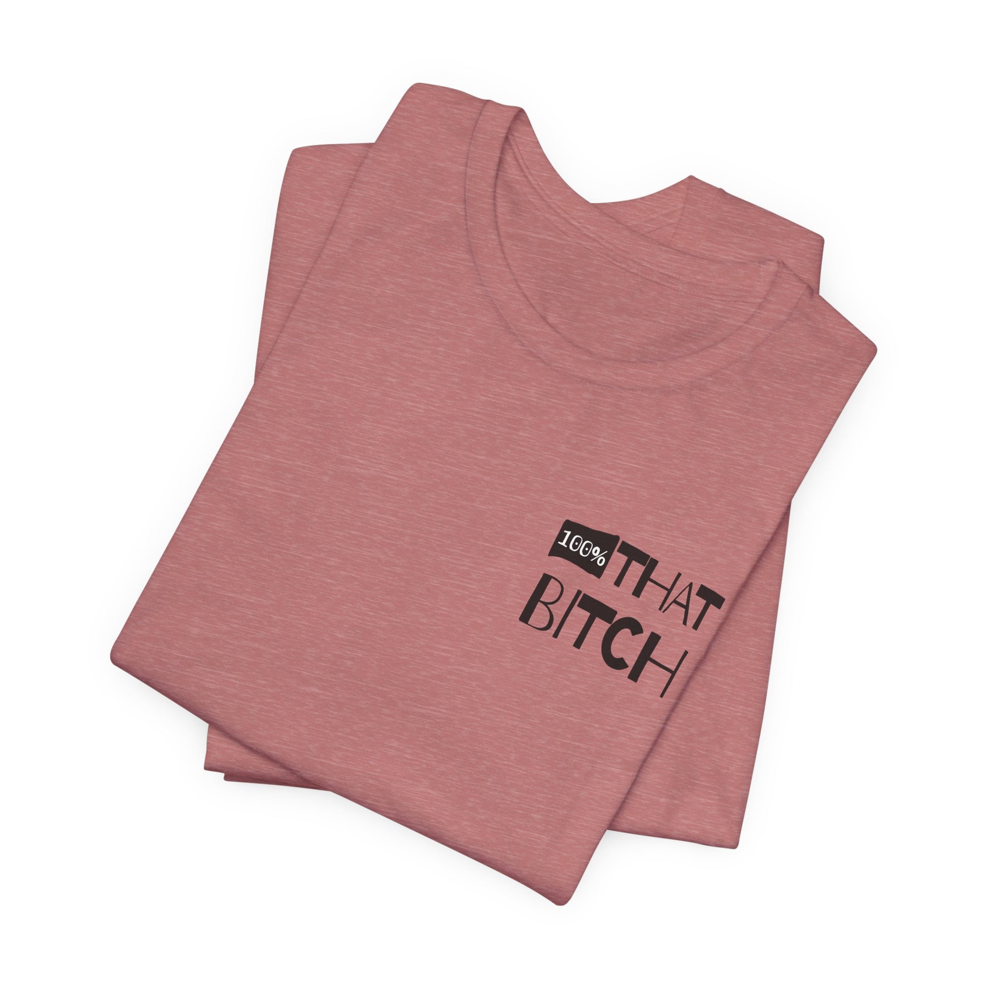 Stack of pink t-shirts with text on a white background  100% that Bitch