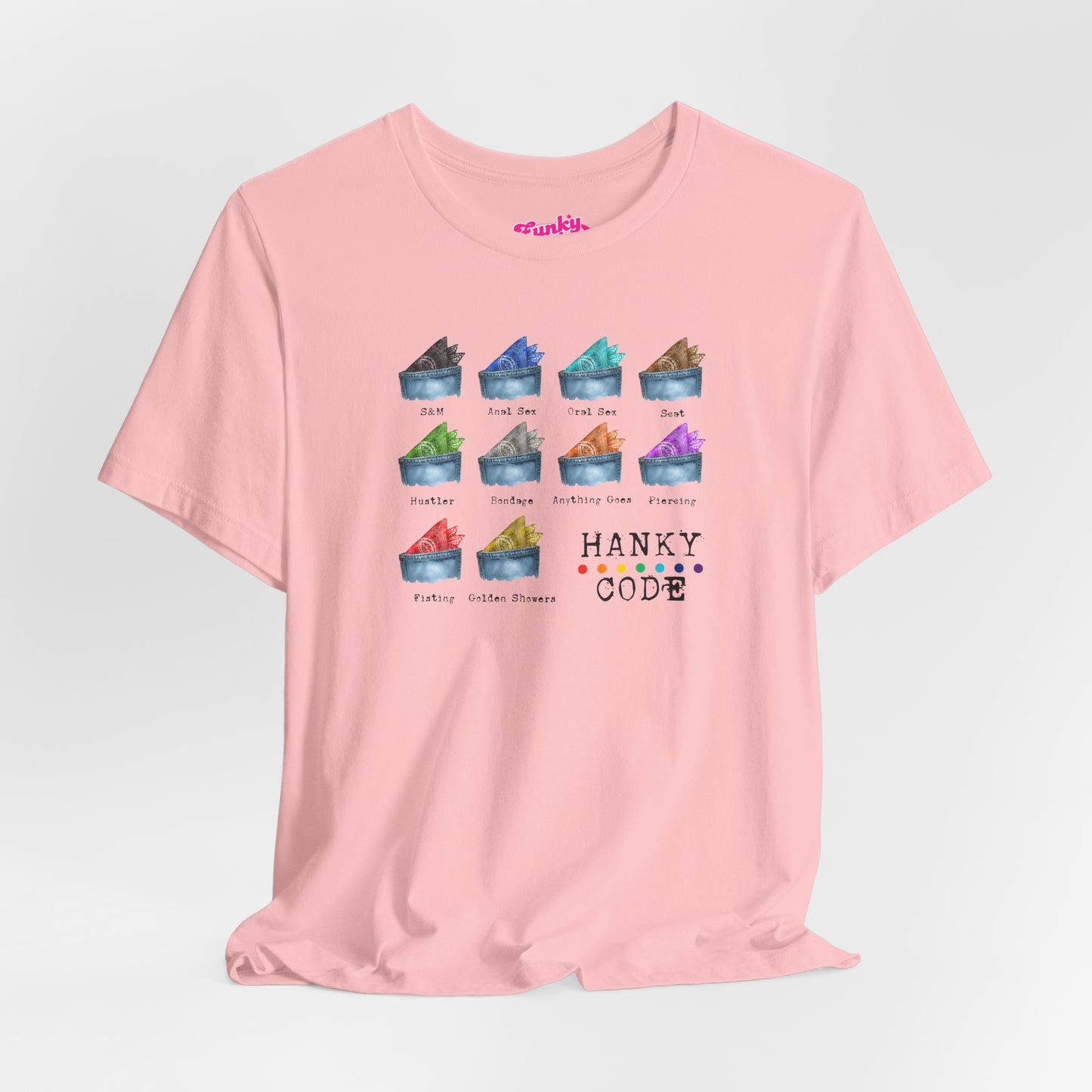 Pink t-shirt with a selection of small graphic images of pockets with a paisley print hankies tucked inside. it features the LGBT rainbow colours and the words Hanky Code