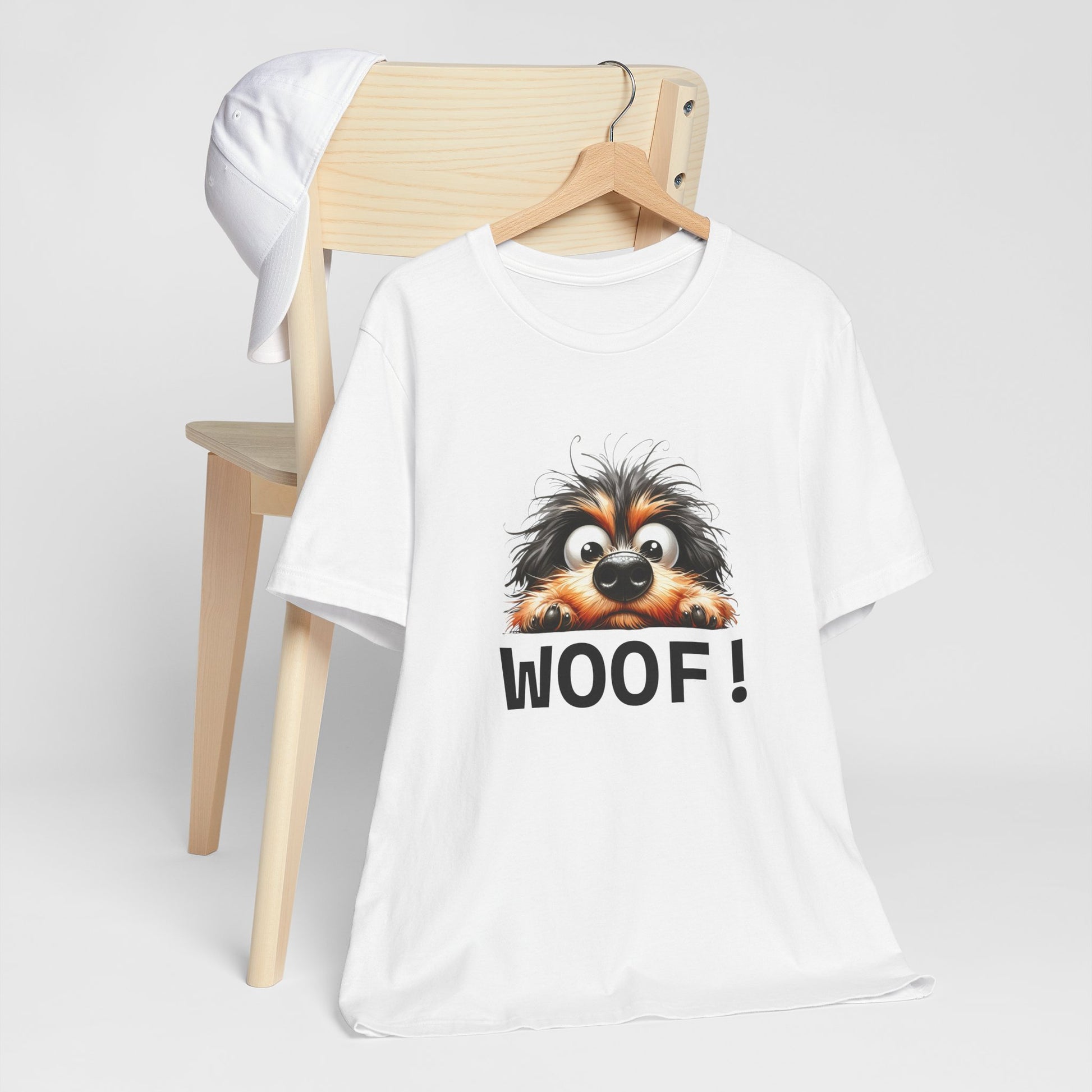 White t-shirt with a dog graphic and 'WOOF!' text on a white background