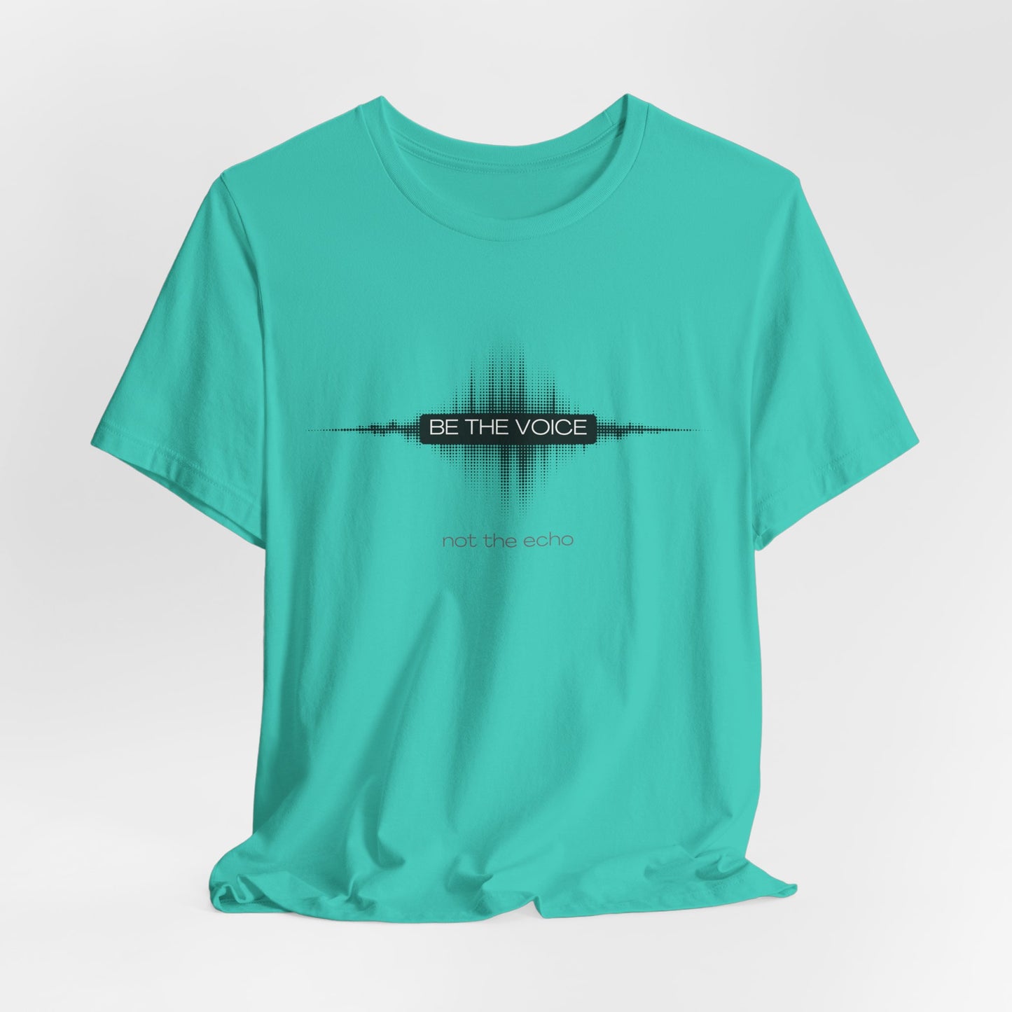 Turquoise t-shirt with 'Be the Voice' text design on a light gray background