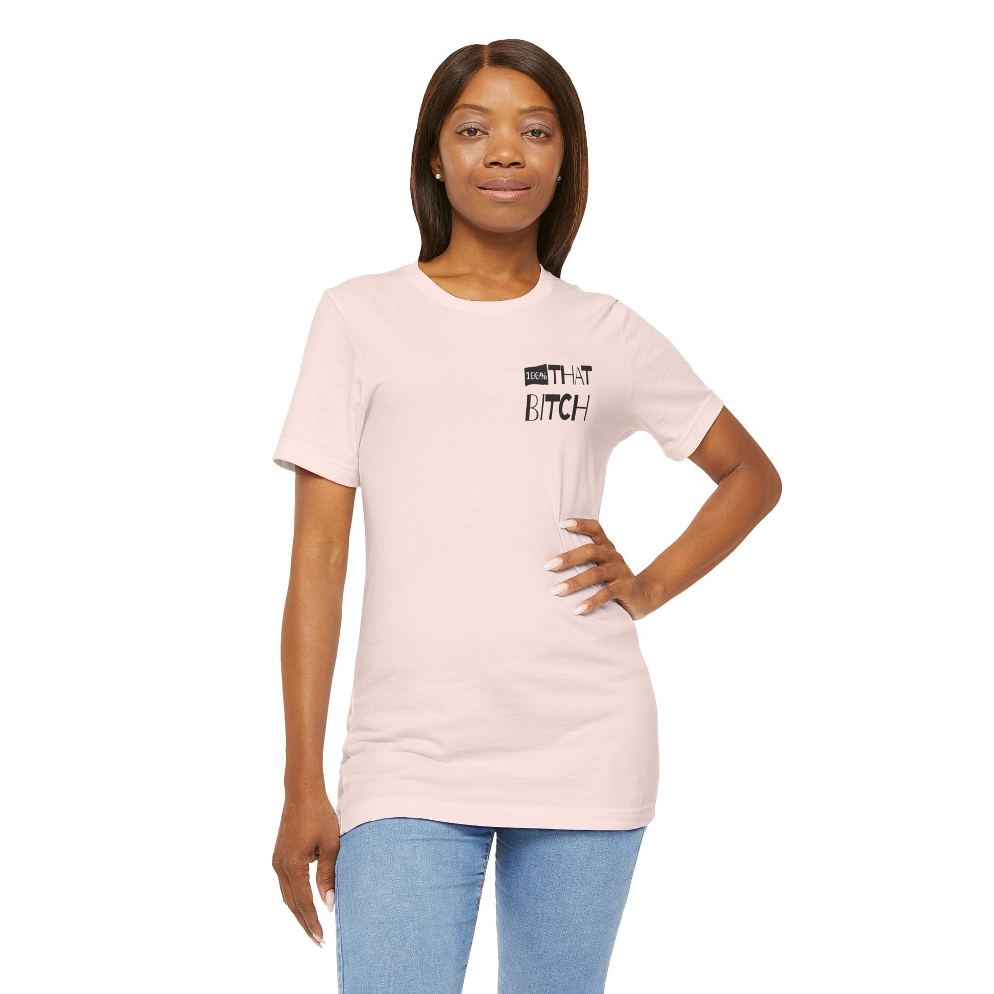Woman wearing a light pink t-shirt with text on a white background  100% that Bitch