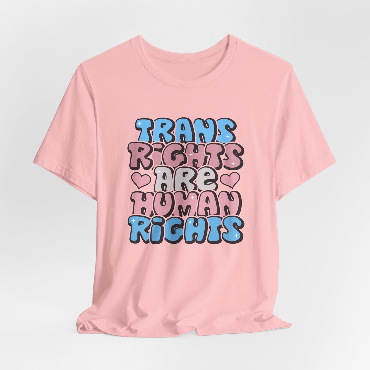 Pink t-shirt with 'Trans Rights Are Human Rights' text on a light gray background LGBTQIA+, Queer, Trans rights