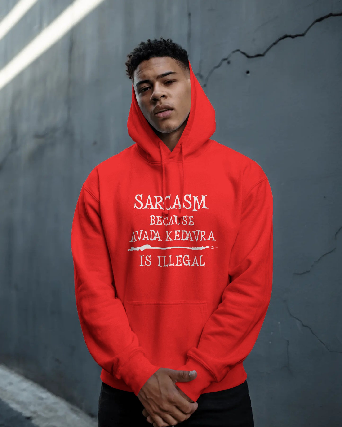 Person wearing a red hoodie with text against a gray wall  Sarcasm, Sarcastic Humor, Harry Potter, potterhead, avada kedavra