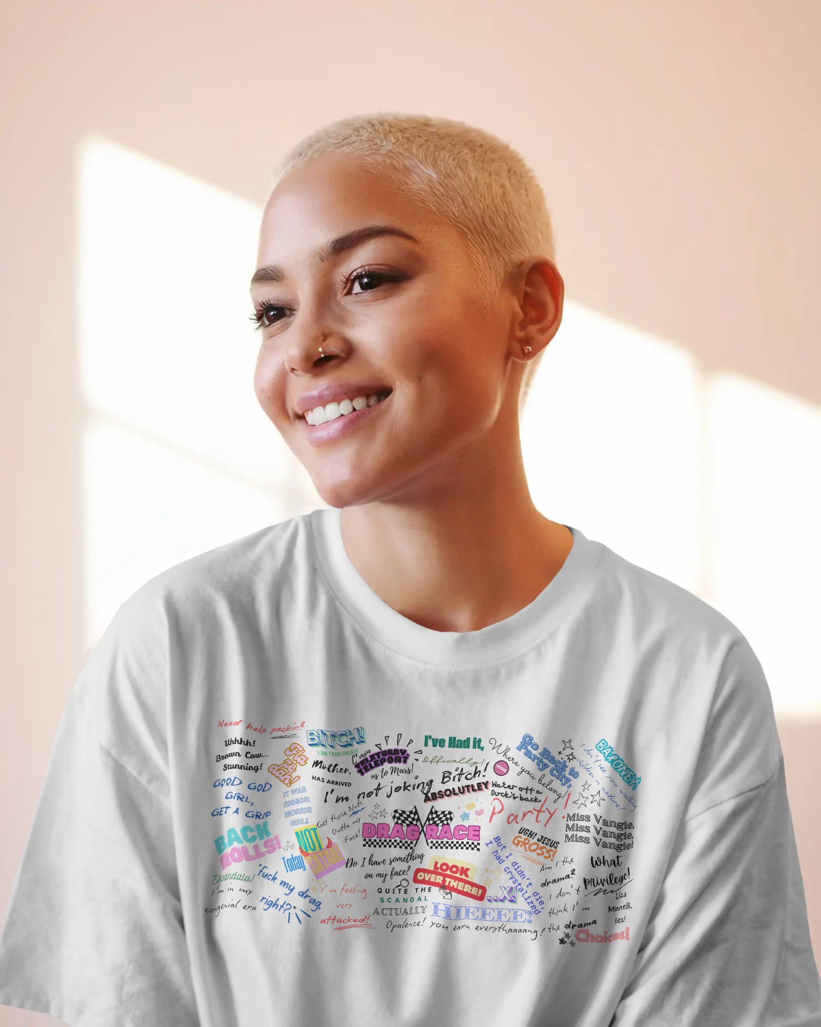 Person wearing a white t-shirt with colorful text design on a light background   Drag race, Dragrace UK, Rupaul Rupaul's drag race. Queer Culture, LGBTQIA+ LGBT