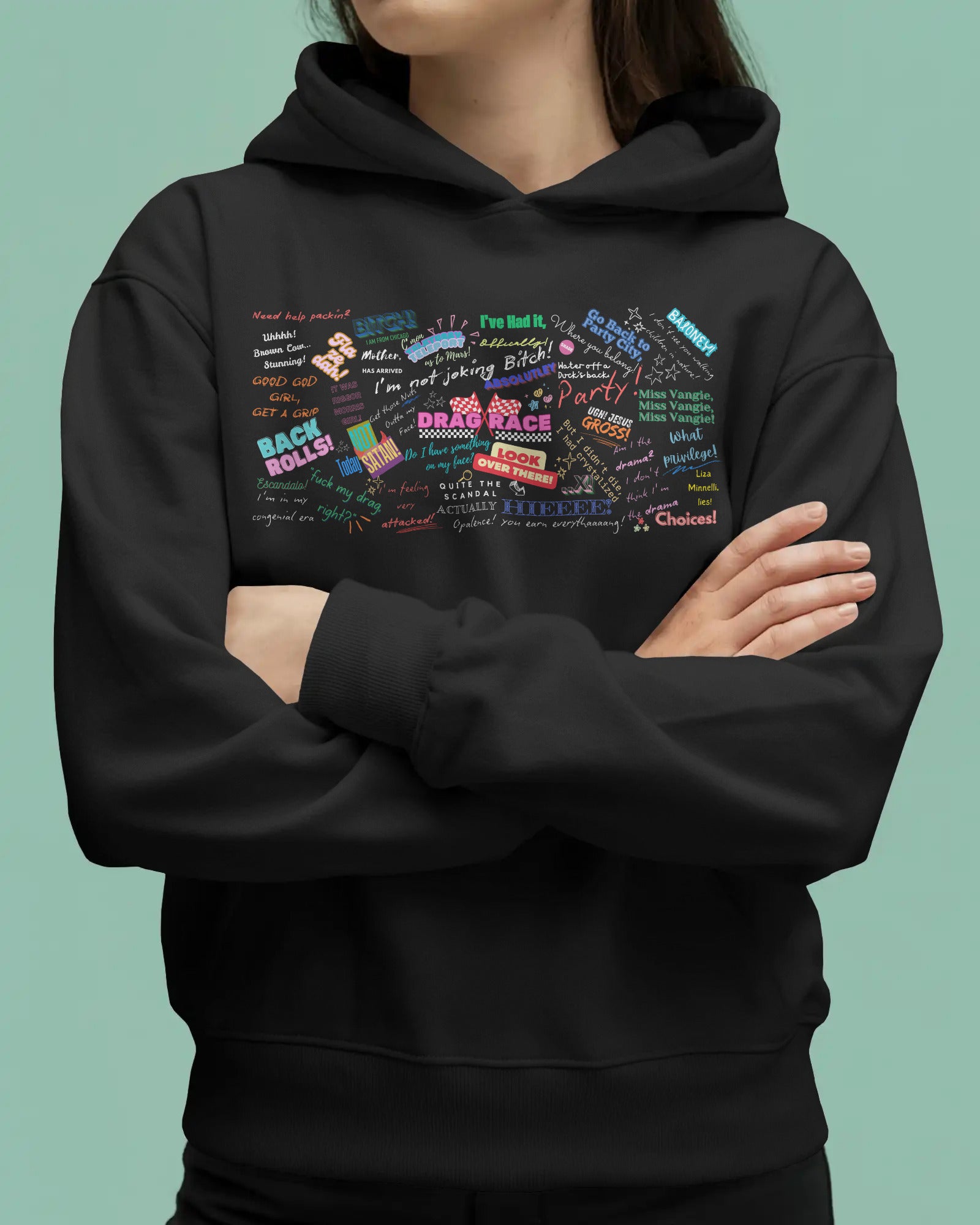 Person wearing a black hoodie with colorful text design on a solid background  Drag race, Rupaul, Rupaul's Drag Race UK, LGBT, Queer Culture, Gay, Drag Queen