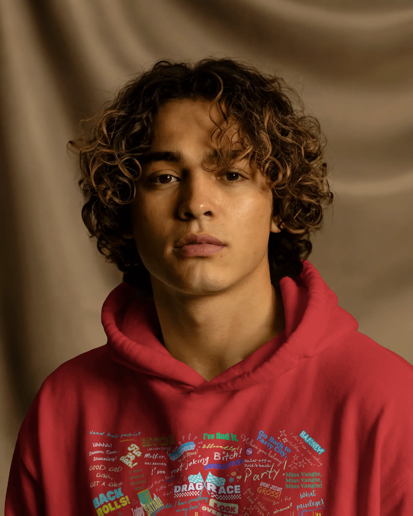 Person wearing a red hoodie with text against a brown background  Drag race, Rupaul, Rupaul's Drag Race UK, LGBT, Queer Culture, Gay, Drag Queen