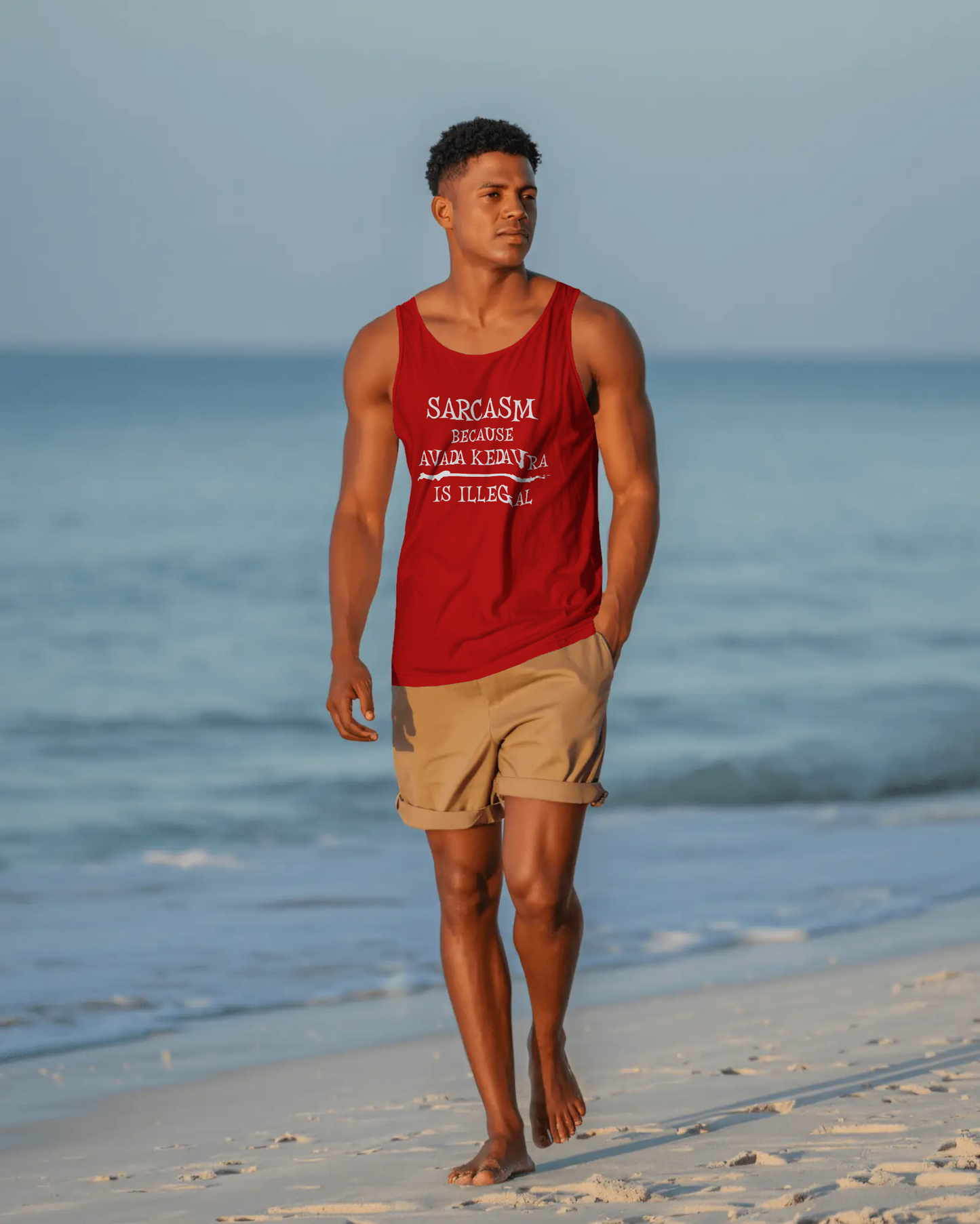 Man walking on a beach wearing a red tank top with text and beige shorts. Sarcasm, Sarcastic Humor, Harry Potter, Potter head, Avada Kedavra