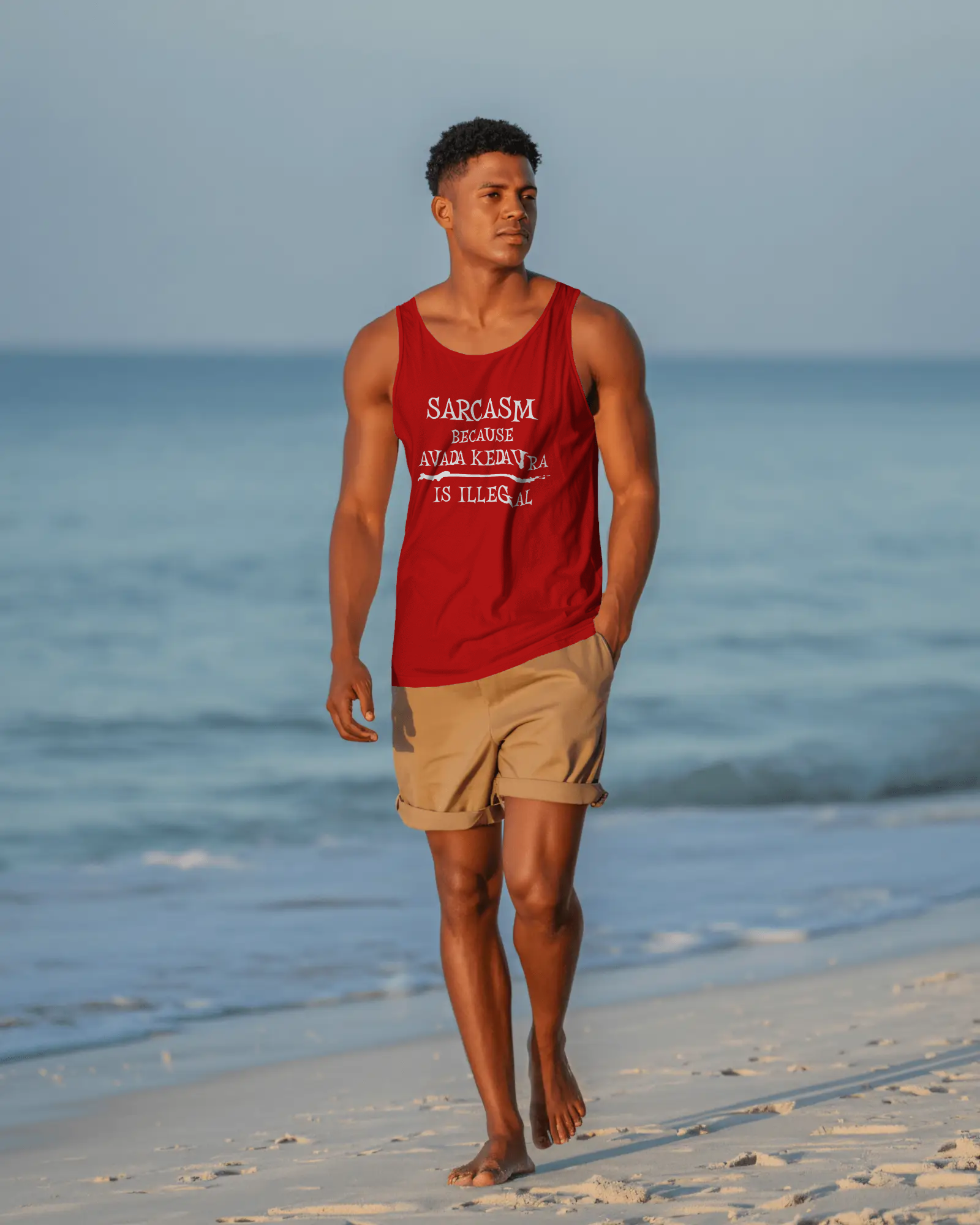 Man walking on a beach wearing a red tank top with text and beige shorts. Sarcasm, Sarcastic Humor, Harry Potter, Potter head, Avada Kedavra