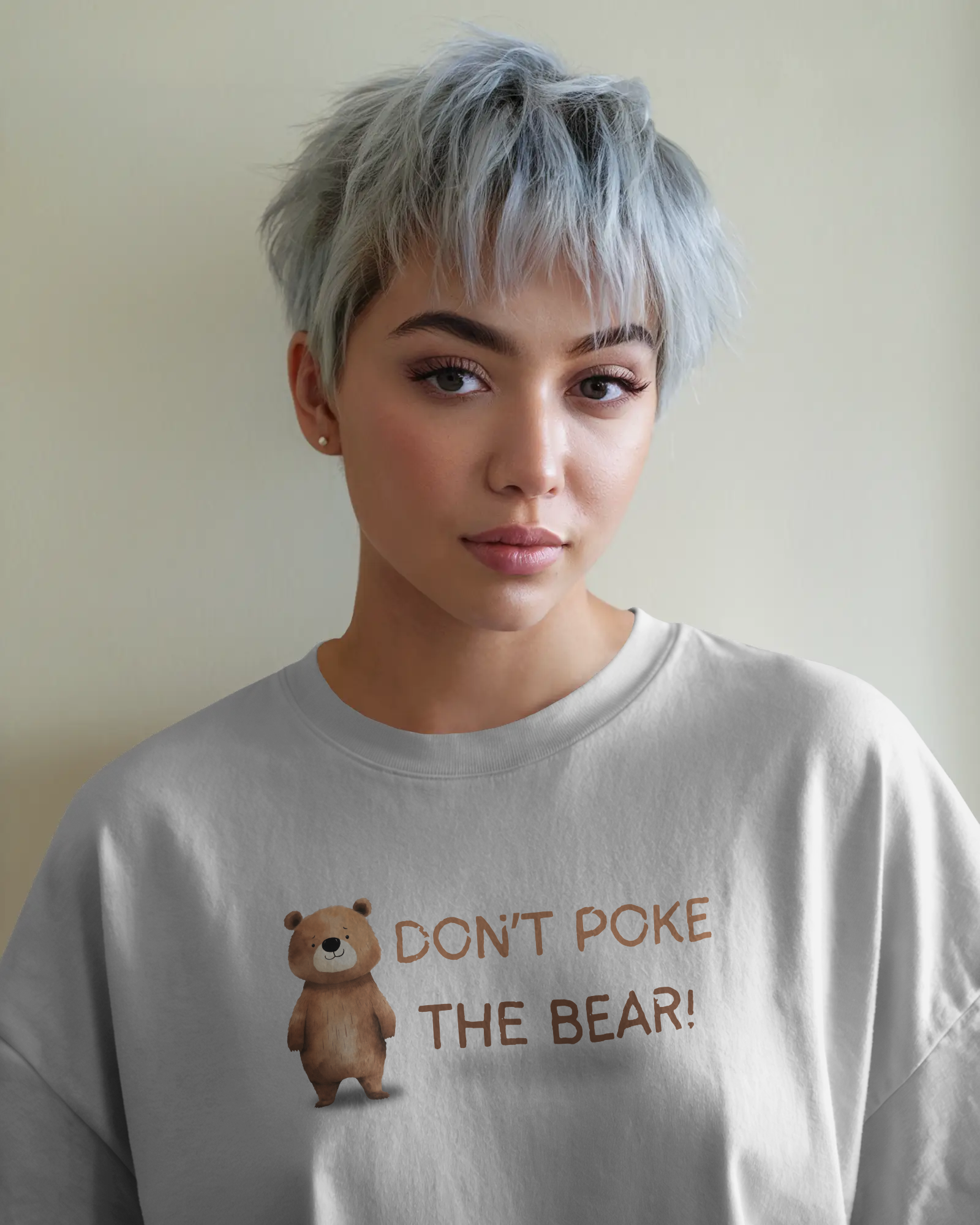 Person wearing a t-shirt with a bear graphic and text