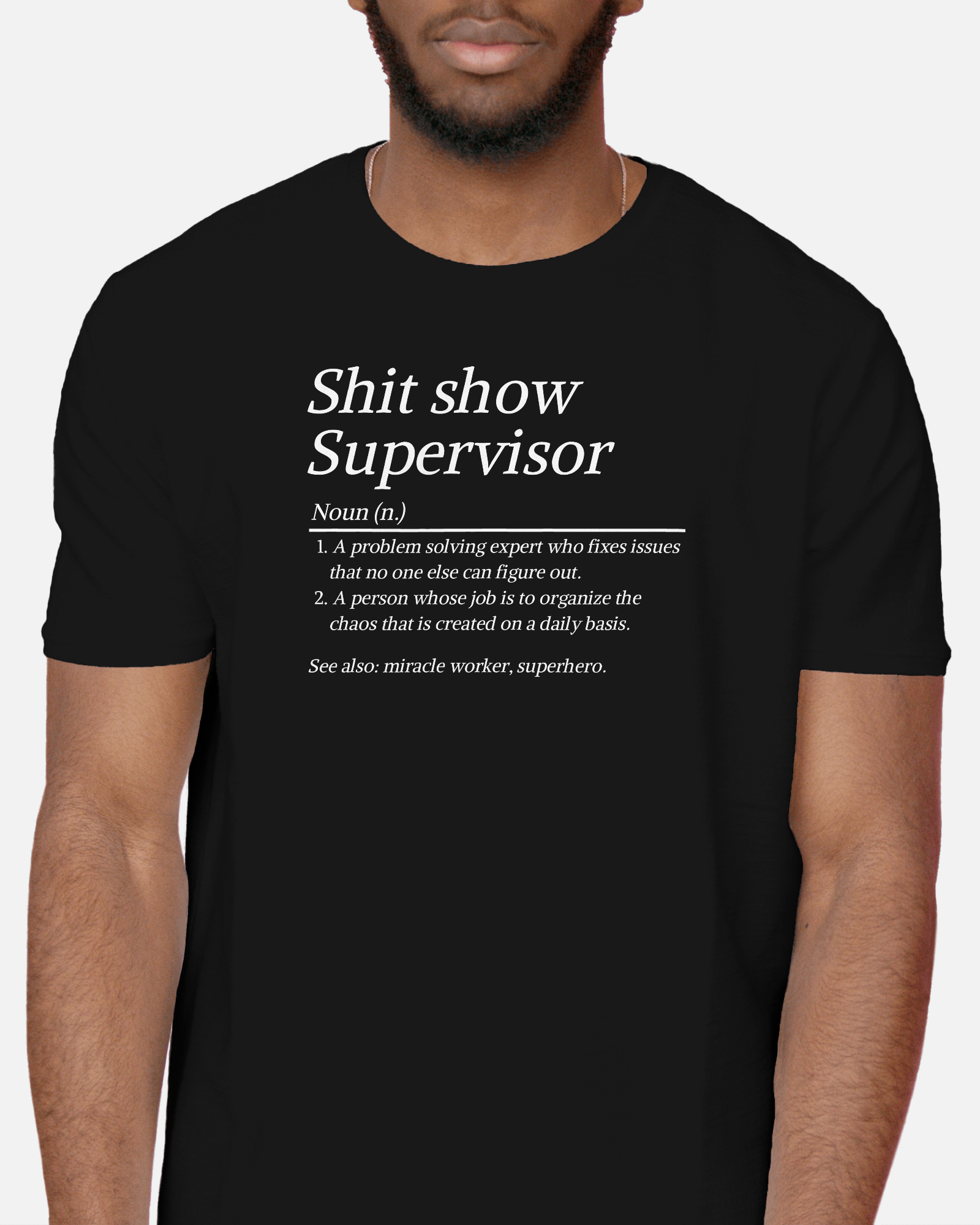 Black t-shirt with text design worn by a person on a plain background