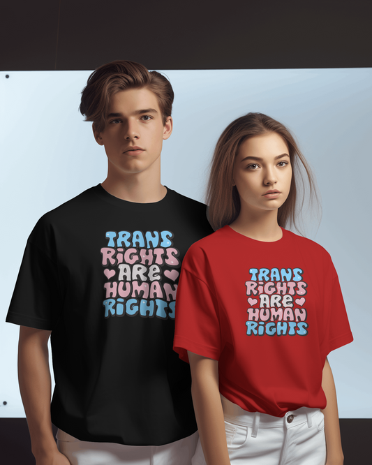 Two people wearing t-shirts with 'Trans Rights Are Human Rights' text.  LGBTQIA+, Queer, Trans rights