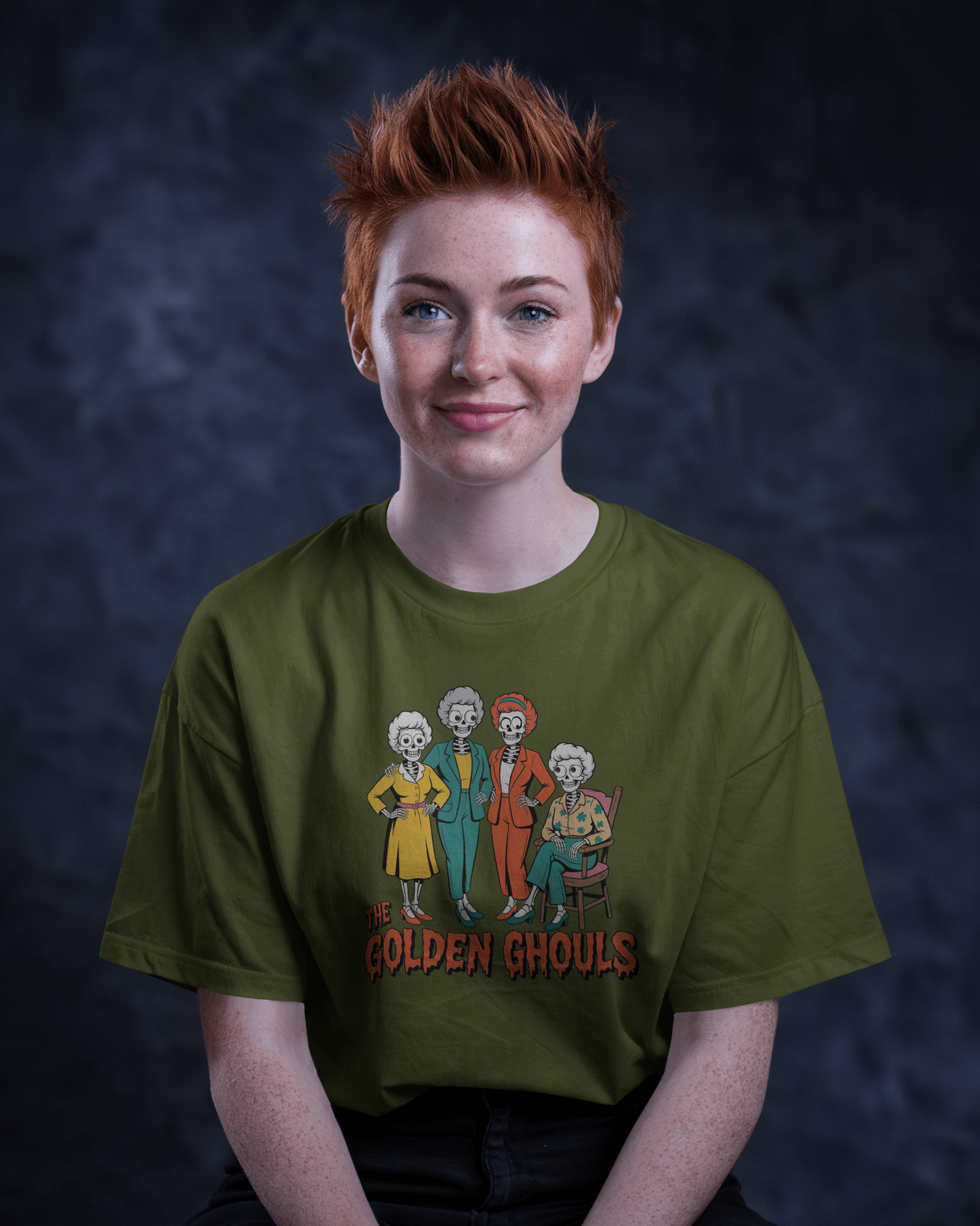 Person wearing a green t-shirt with 'The Golden Ghoul' design against a dark background   Golden Girls, 80s TV, Halloween Tees
