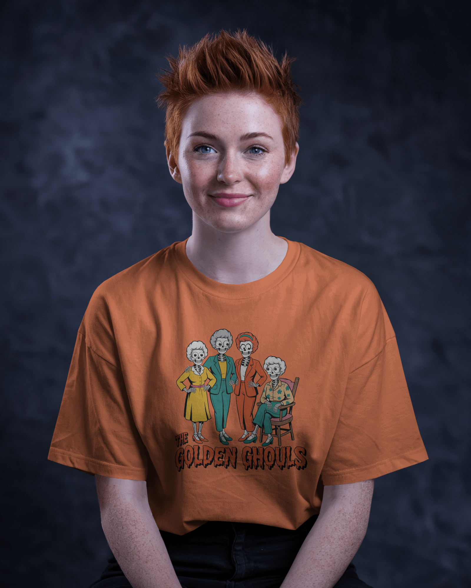 Person wearing an orange t-shirt with a graphic design on a dark background   Golden Girls, 80s TV, Halloween Tees