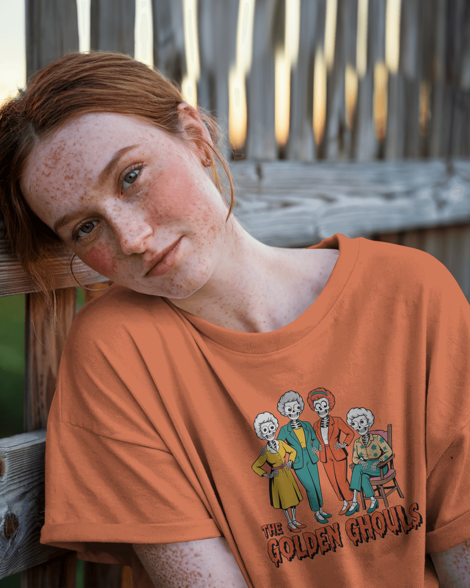 Person wearing an orange t-shirt with 'The Golden Girls' graphic design.   Golden Girls, 80s TV, Halloween Tees
