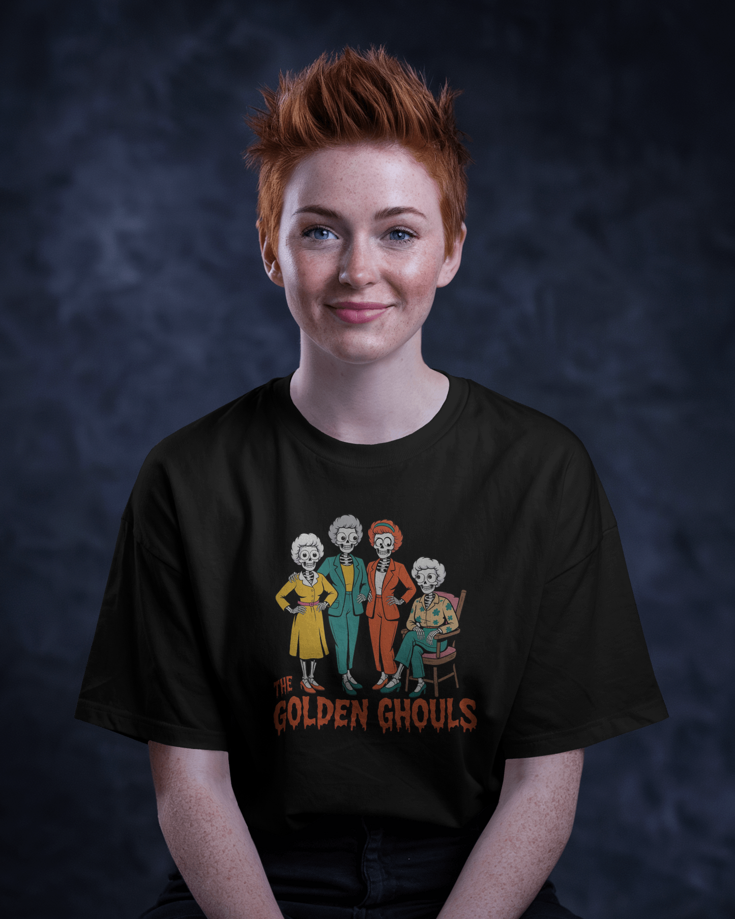 Person wearing a black t-shirt with 'The Golden Ghouls' design against a dark background   Golden Girls, 80s TV, Halloween Tees