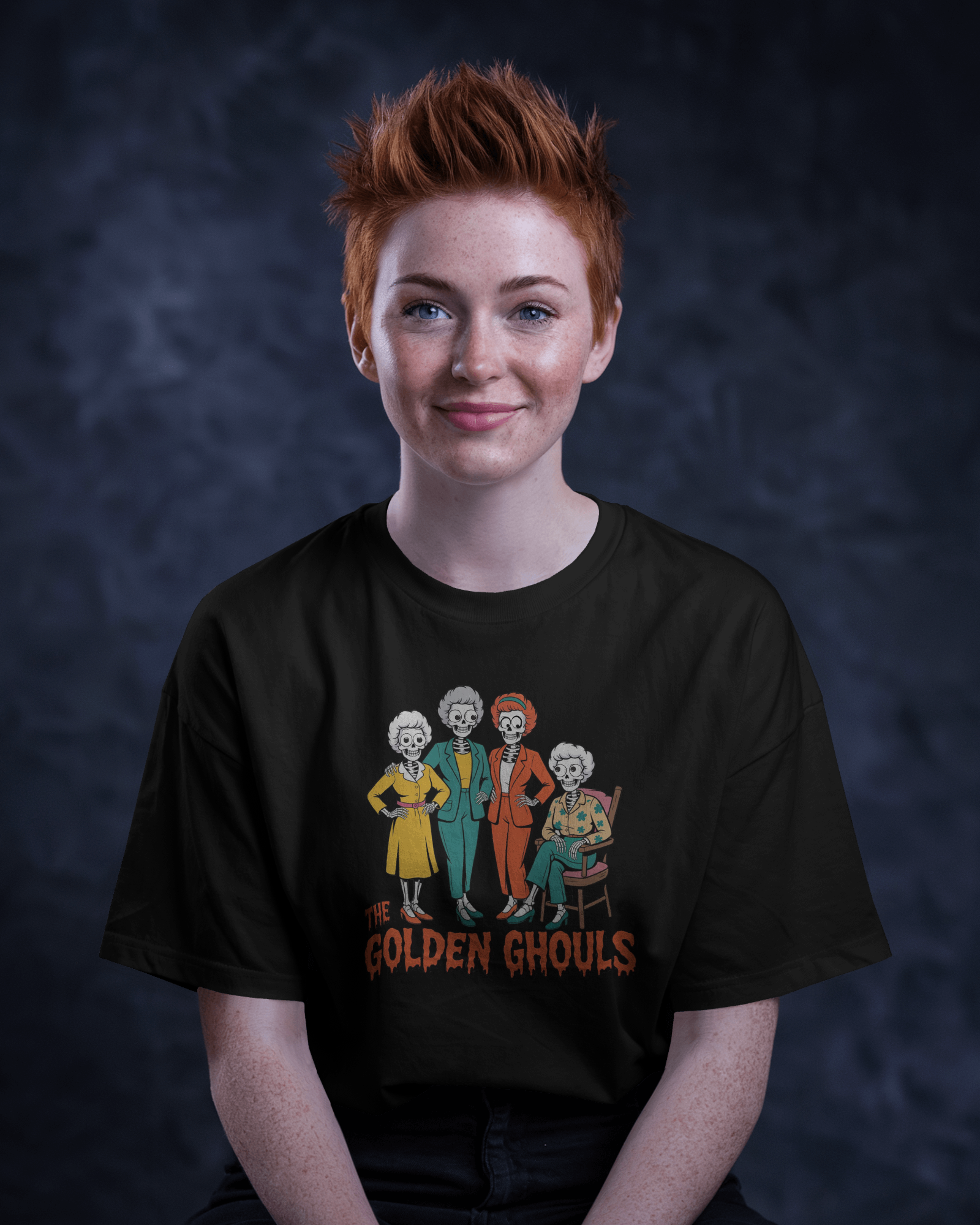 Person wearing a black t-shirt with 'The Golden Ghouls' design against a dark background   Golden Girls, 80s TV, Halloween Tees