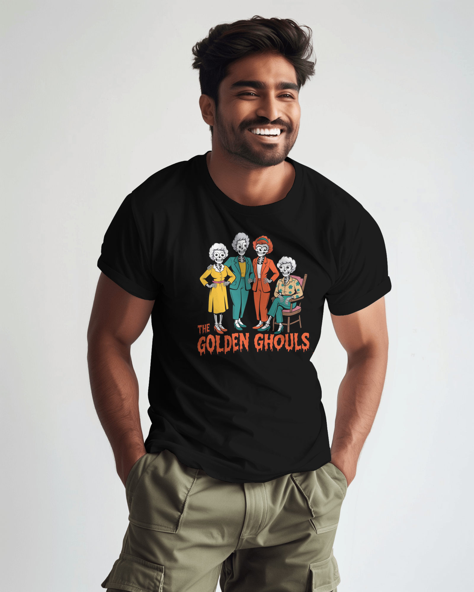 Man wearing a black t-shirt with 'The Golden Ghouls' graphic design on a plain background   Golden Girls, 80s TV, Halloween Tees