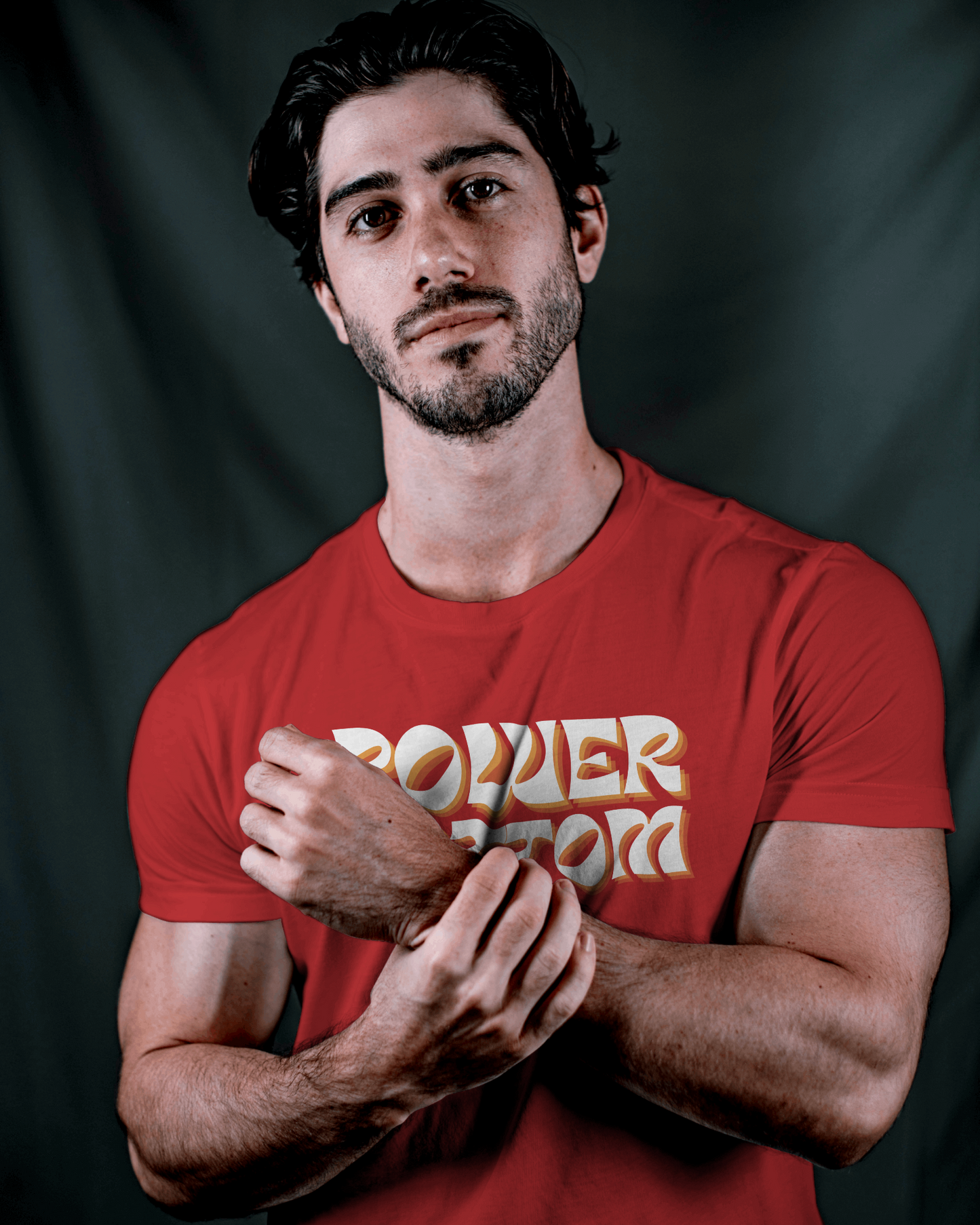 Man wearing a red t-shirt with 'POWER WORD' text against a dark background Kink, LGBTQIA+, Queer Sub Dom 