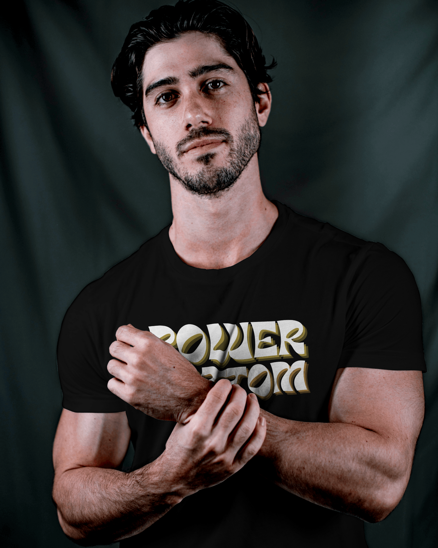 Man wearing a black t-shirt with 'POWER BEAST' text on a dark backgroundKink, LGBTQIA+, Queer Sub Dom 