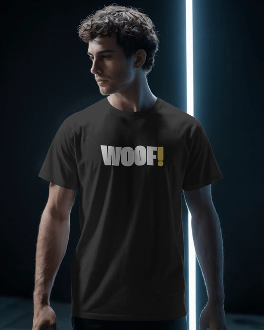 Man wearing a black t-shirt with 'WOOF!' text against a dark background LGBTQIA+ QUEER, Kink Positive