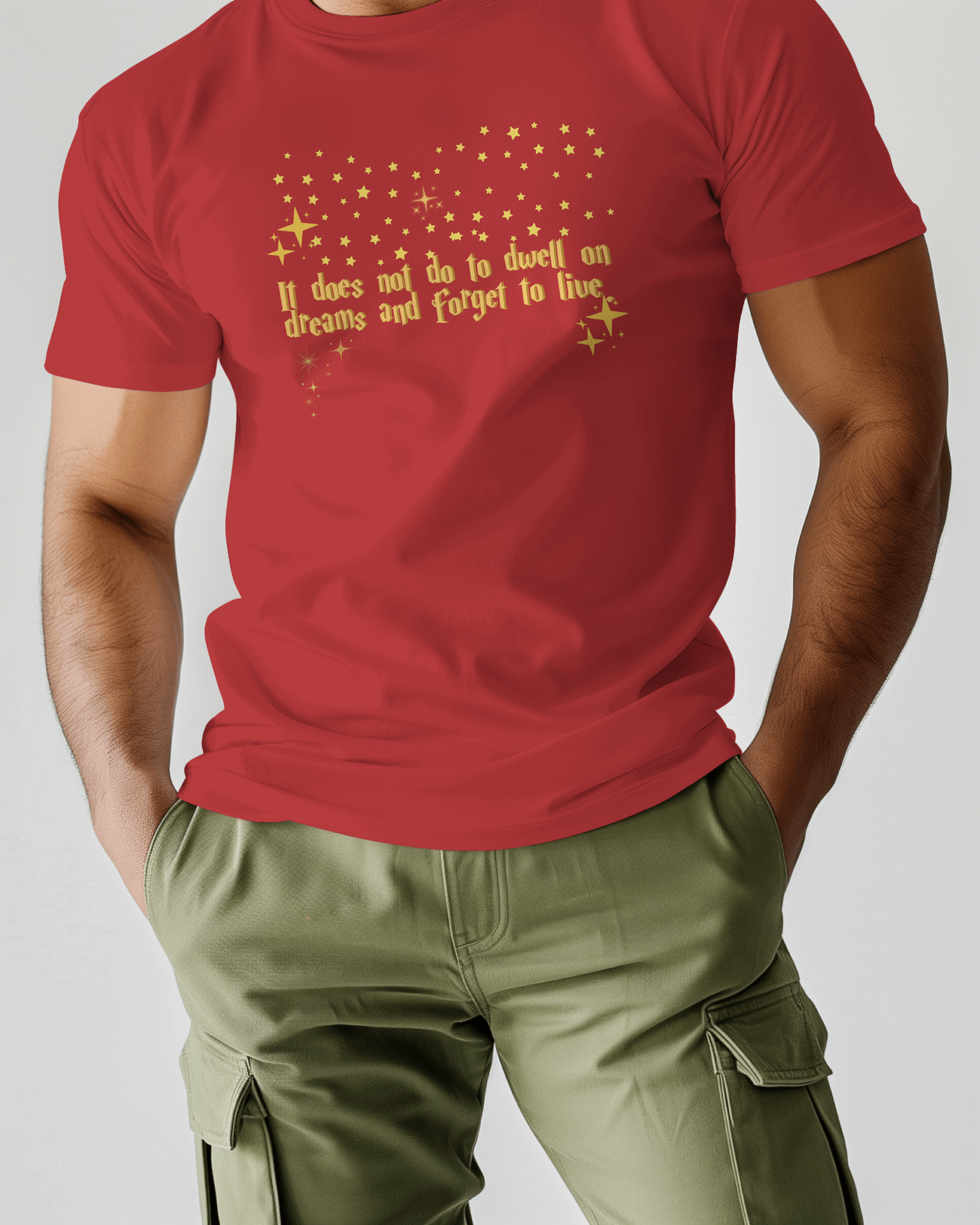 Red t-shirt with gold text worn by a person on a plain background, Dumbledore quote, harry potter