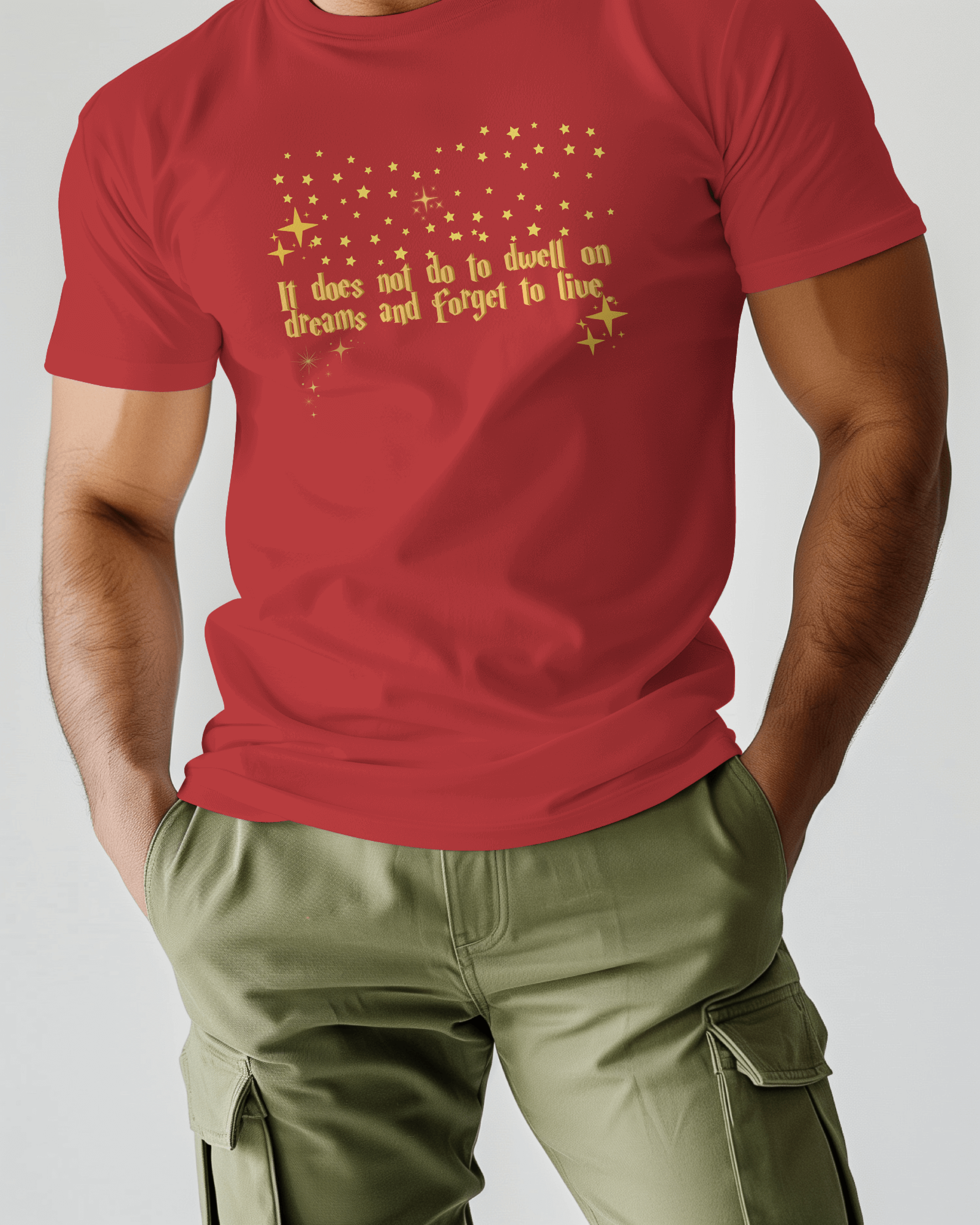 Red t-shirt with gold text worn by a person on a plain background, Dumbledore quote, harry potter
